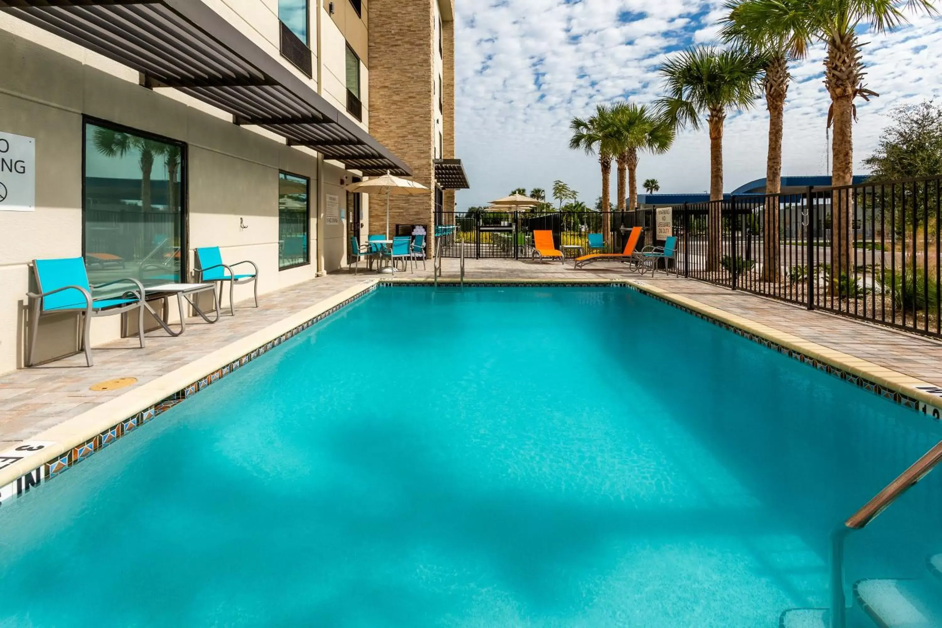 Swimming Pool in Holiday Inn Express & Suites - Ft Myers Beach-Sanibel Gateway, an IHG Hotel
