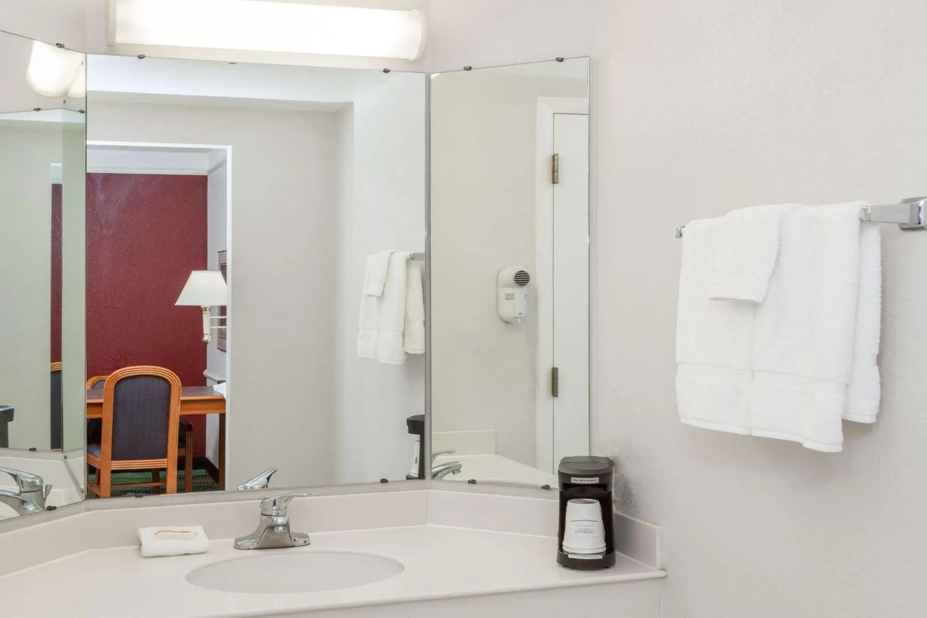 Bathroom in Days Inn & Suites by Wyndham Arlington Heights