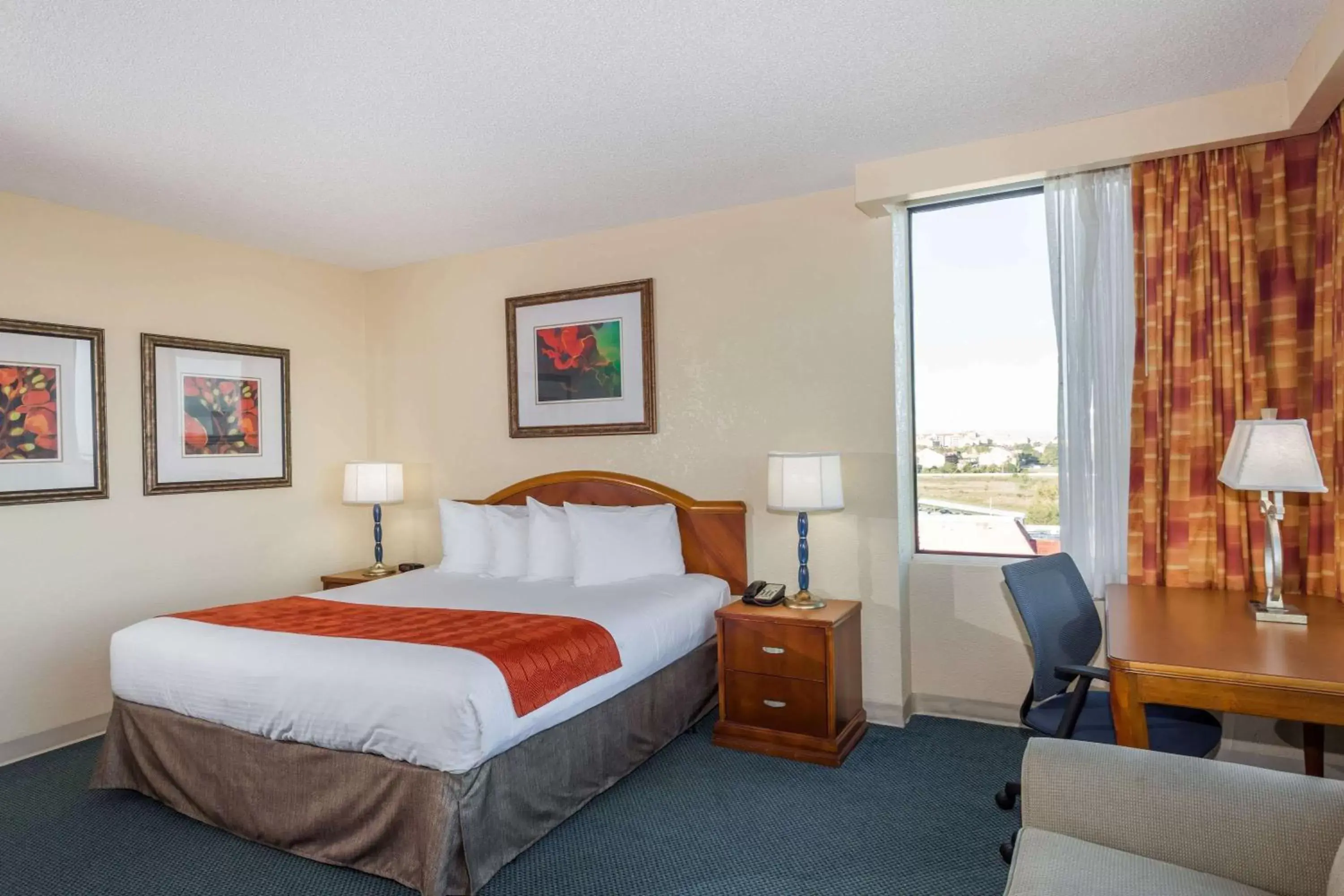 Photo of the whole room, Bed in Ramada by Wyndham Kissimmee Gateway
