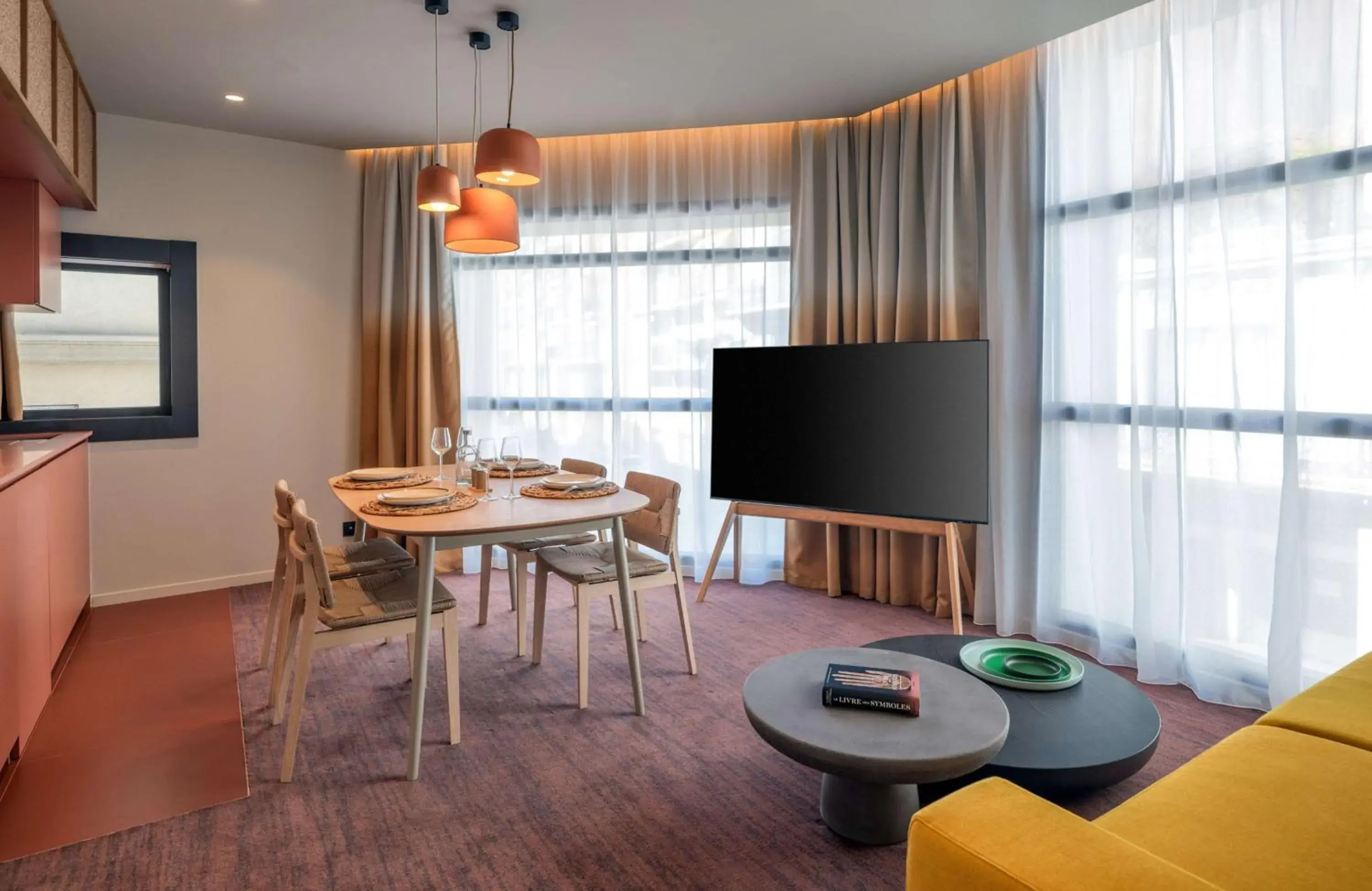 Living room, Dining Area in Canopy by Hilton Cannes