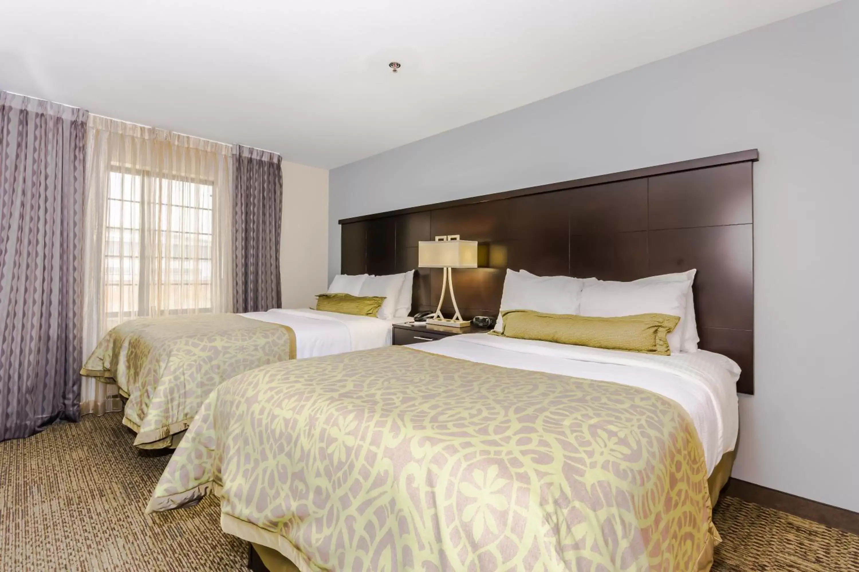 Photo of the whole room, Bed in Staybridge Suites Grand Forks, an IHG Hotel