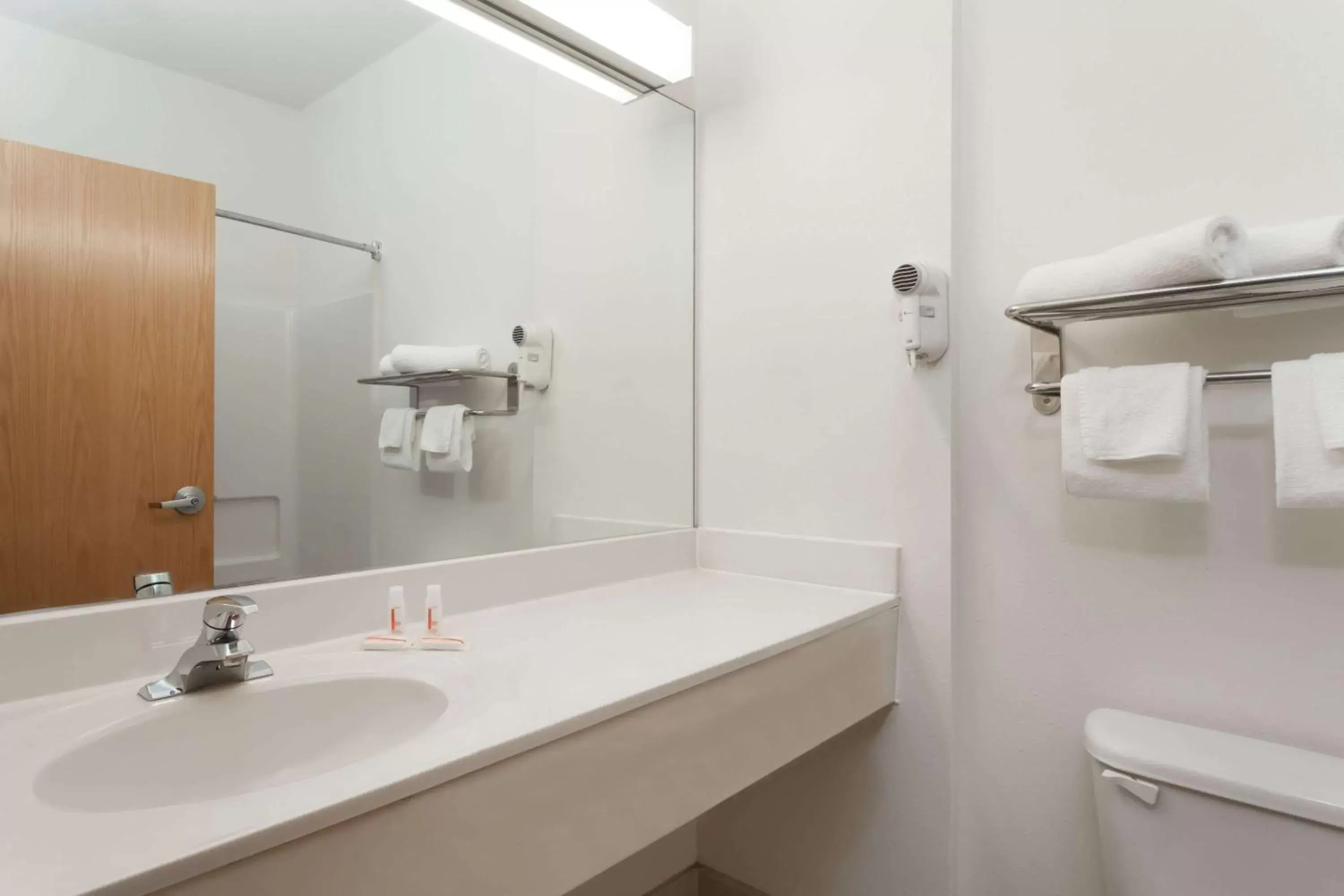 Bathroom in Days Inn & Suites by Wyndham Cambridge