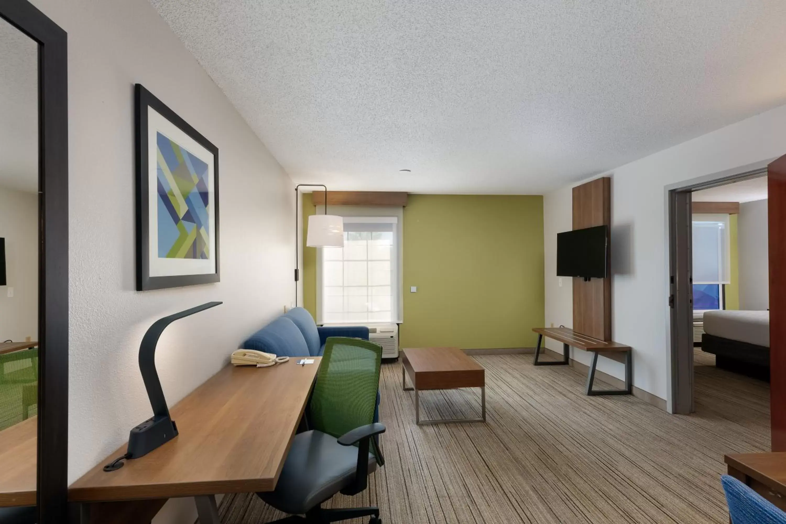 Photo of the whole room, Seating Area in Holiday Inn Express & Suites Milton East I-10, an IHG Hotel