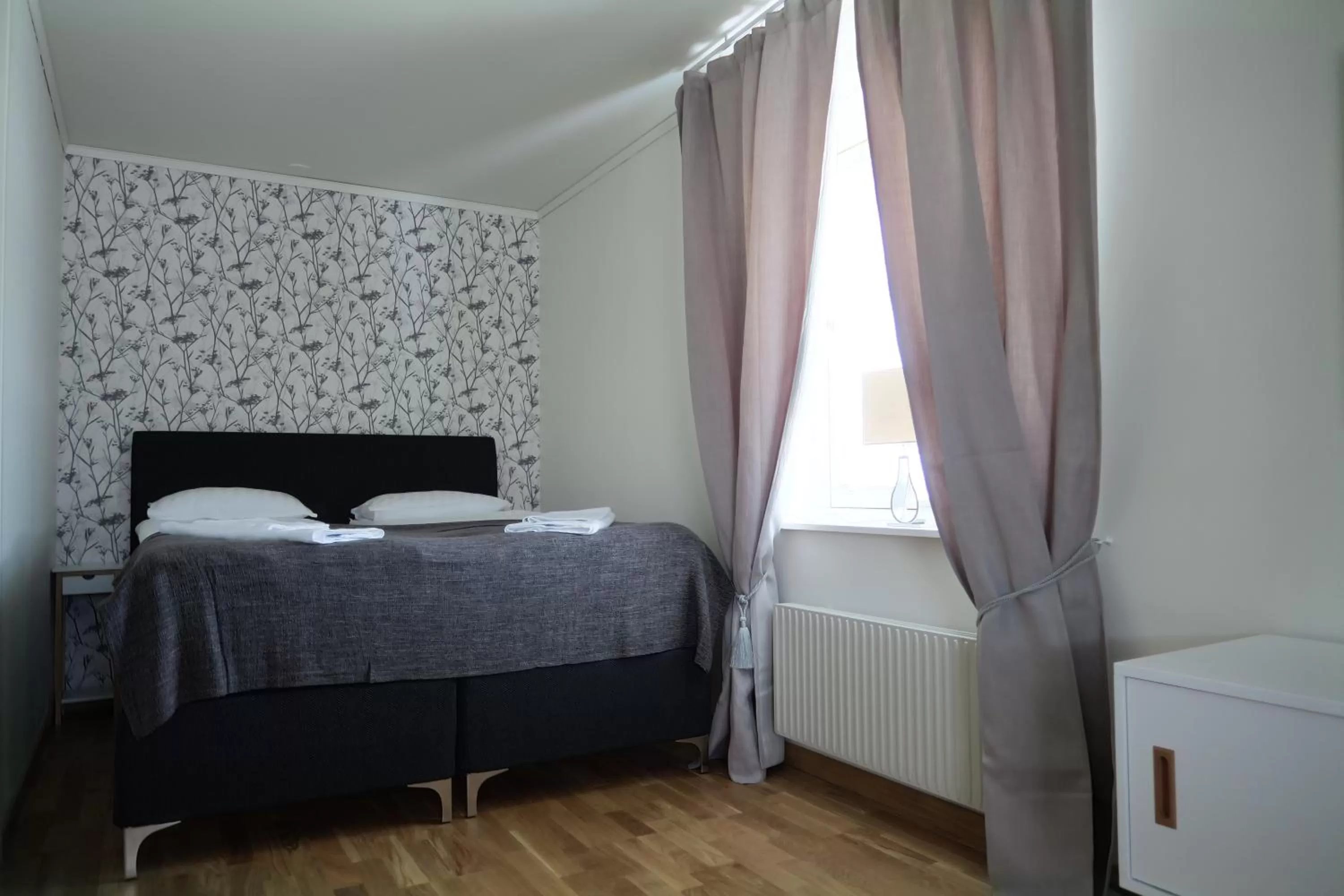 Bed in Easy Livin' Apartment Hotel