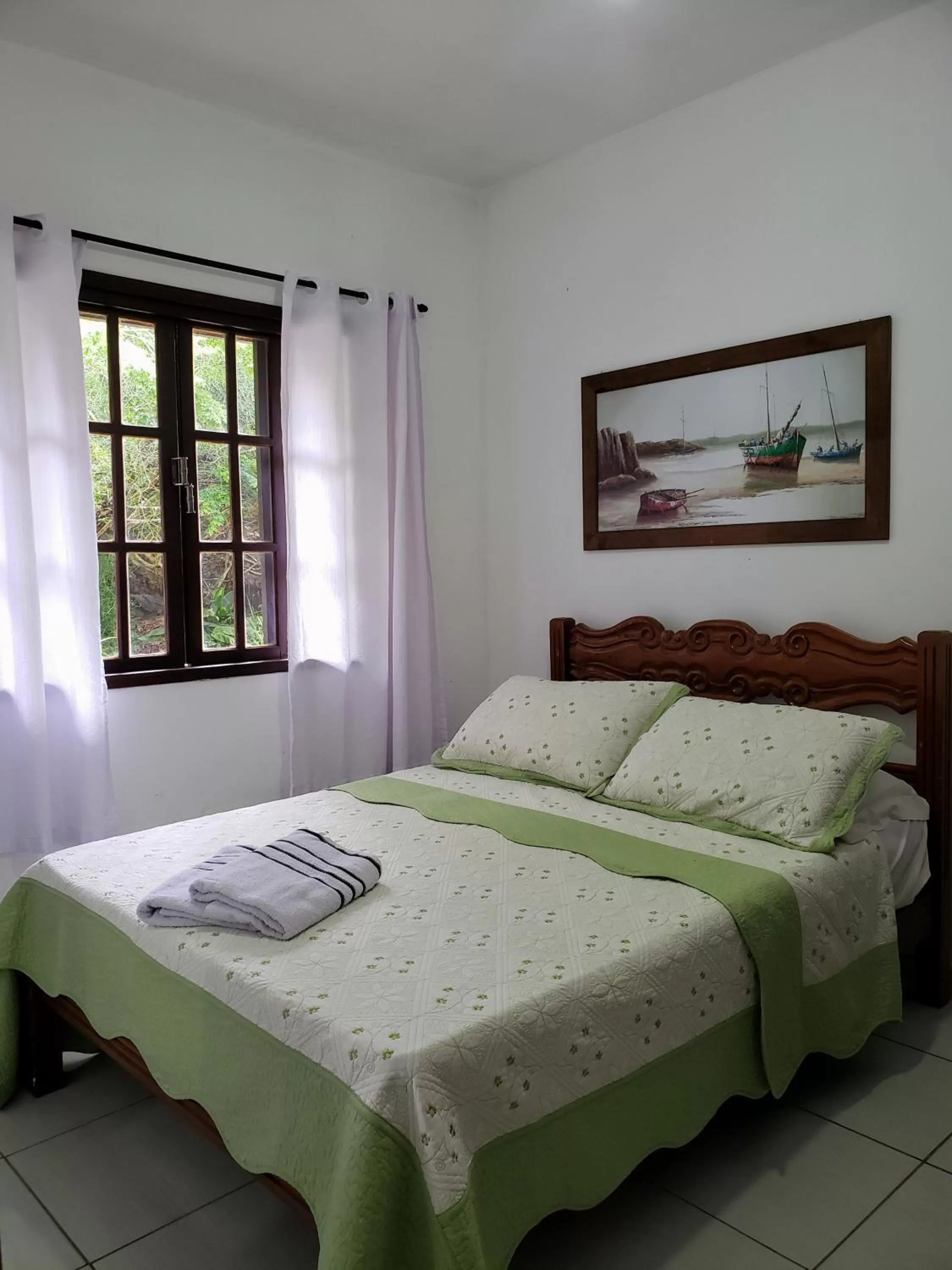 Bed in Pousada Recanto Das Emerências