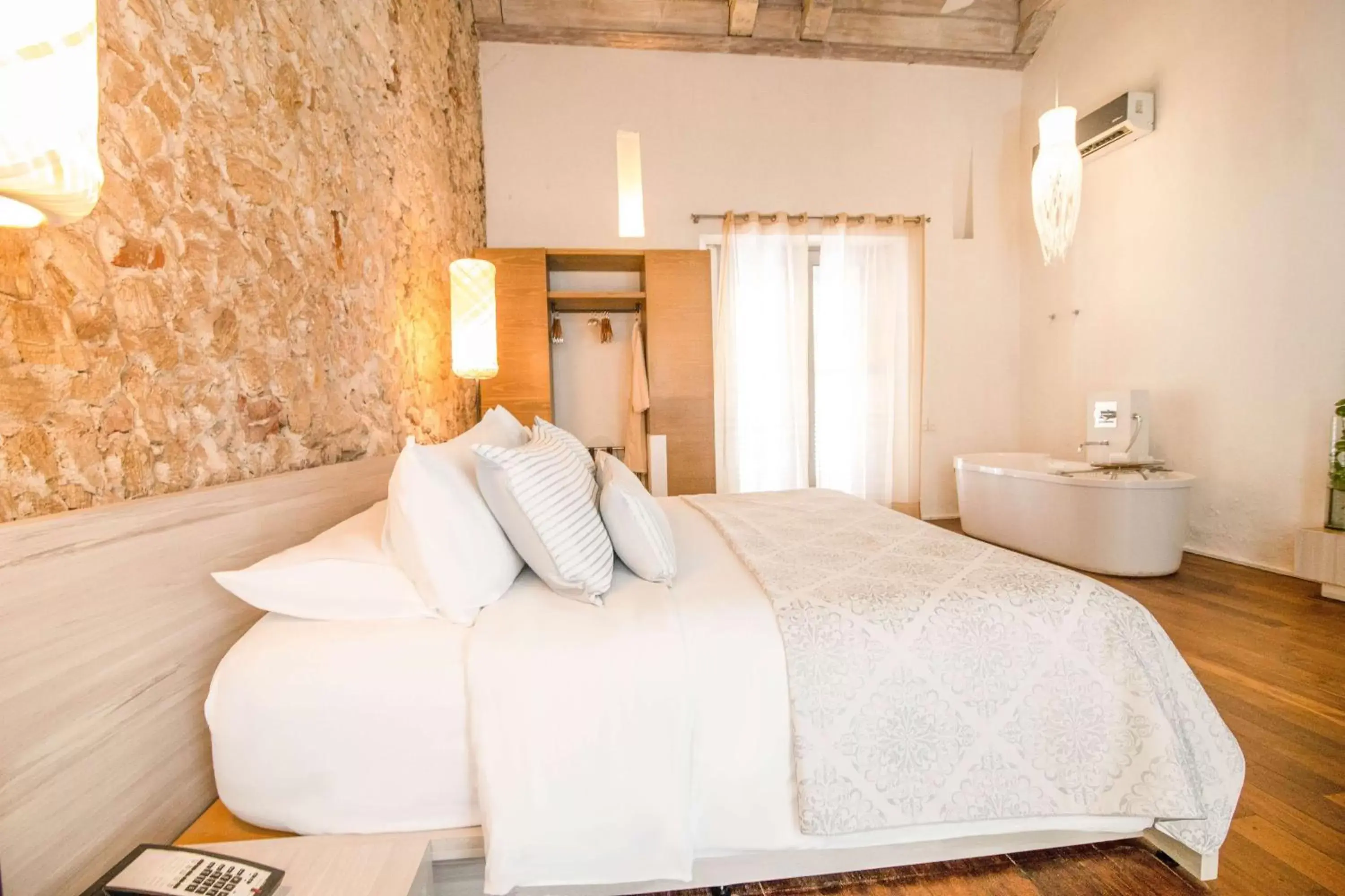 Bed in Nacar Hotel Cartagena, Curio Collection by Hilton