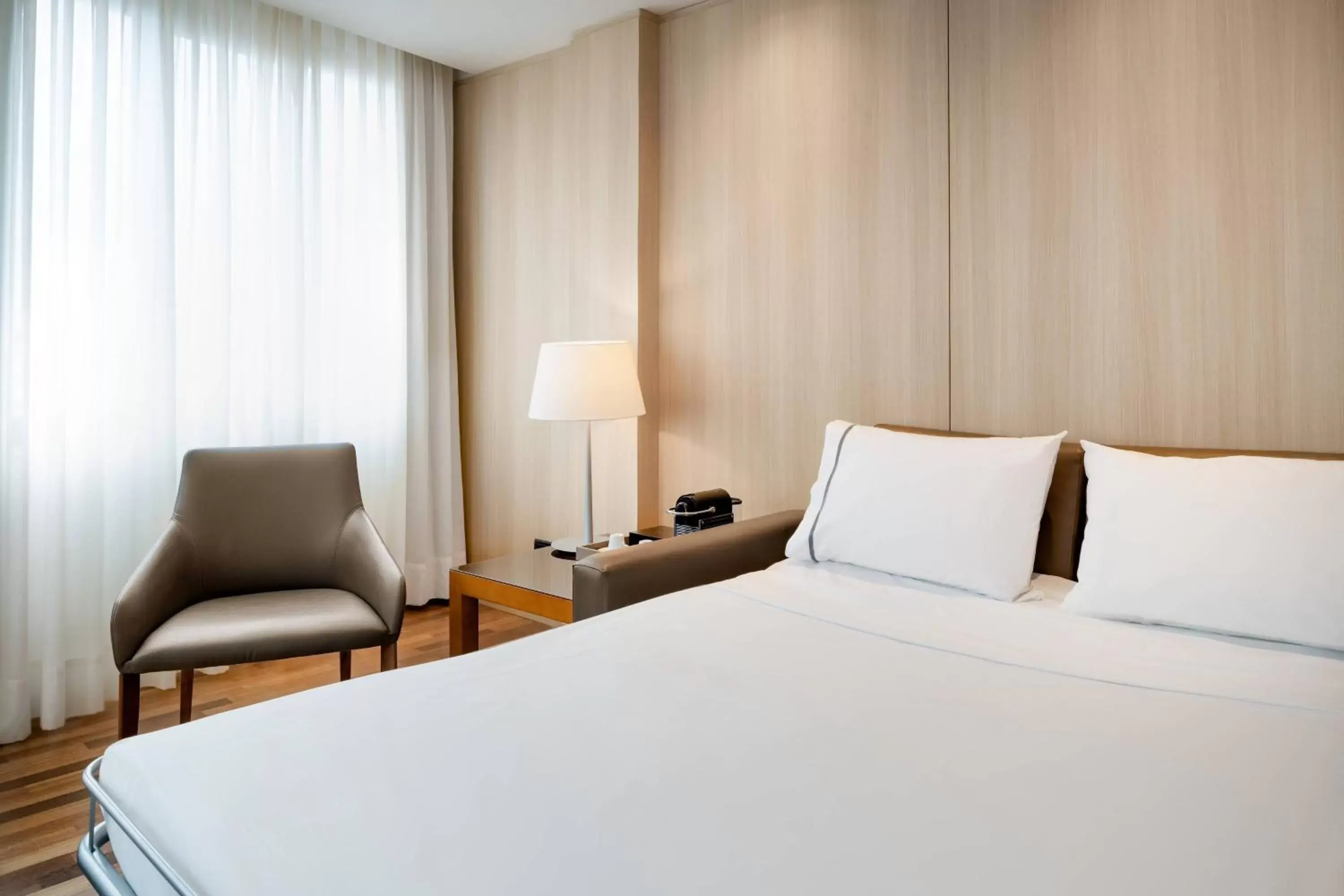Photo of the whole room, Bed in AC Hotel Málaga Palacio by Marriott