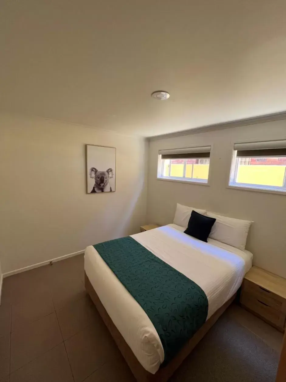 Bed in Tathra Beach House Holiday Apartments