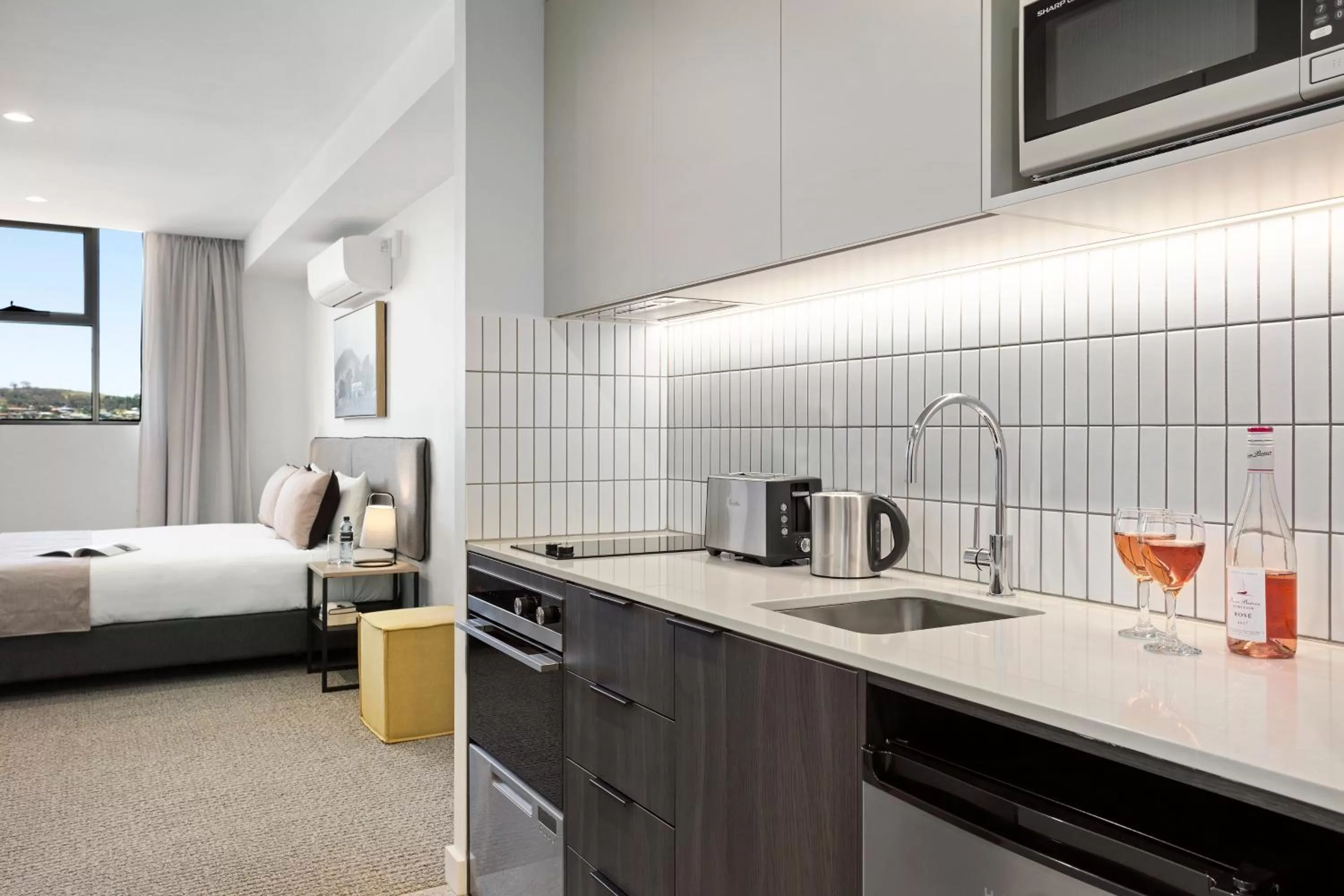 Kitchen or kitchenette, Bed in Quest Goulburn