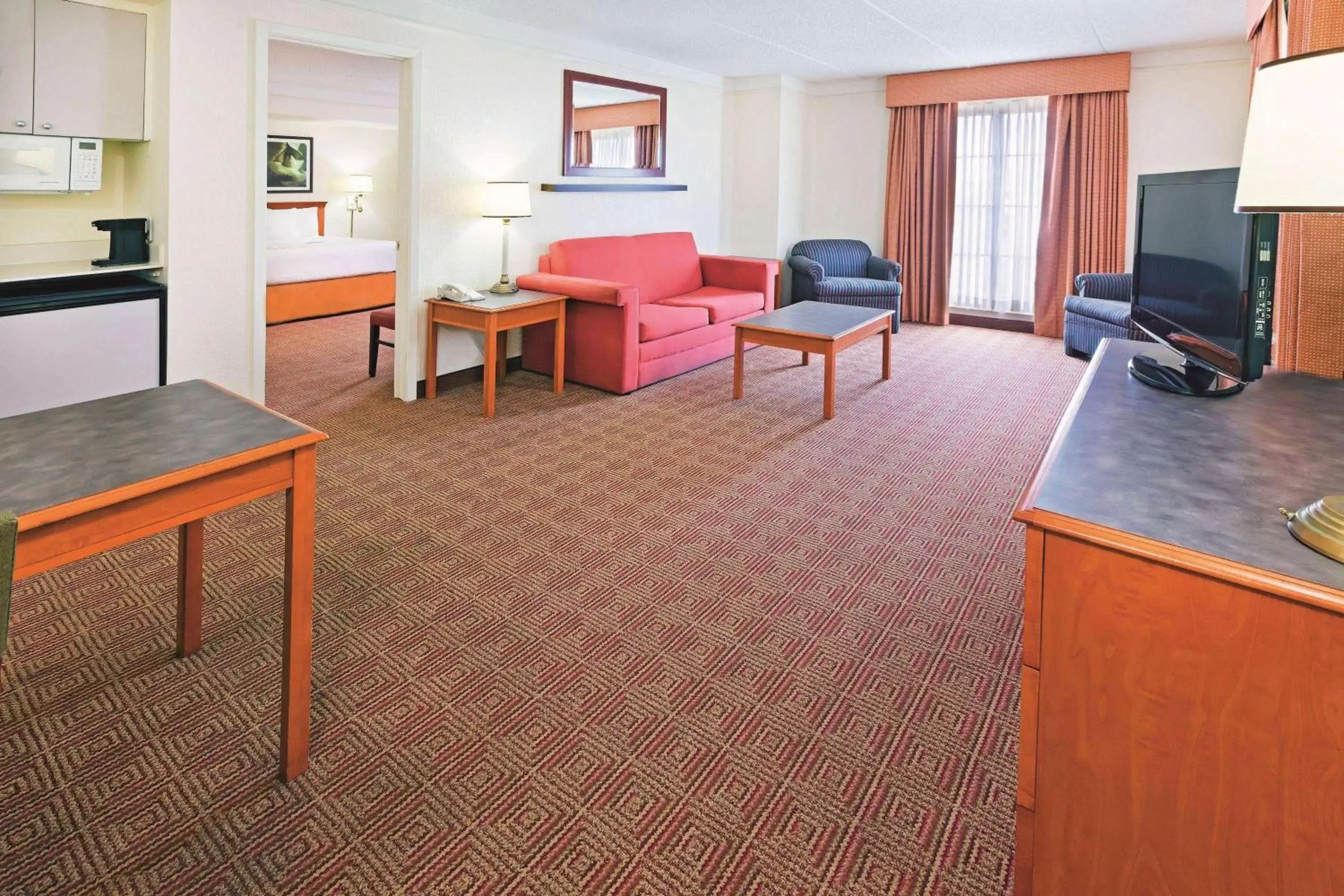 Bed, Seating Area in Super 8 by Wyndham San Antonio Near SeaWorld Ingram Park