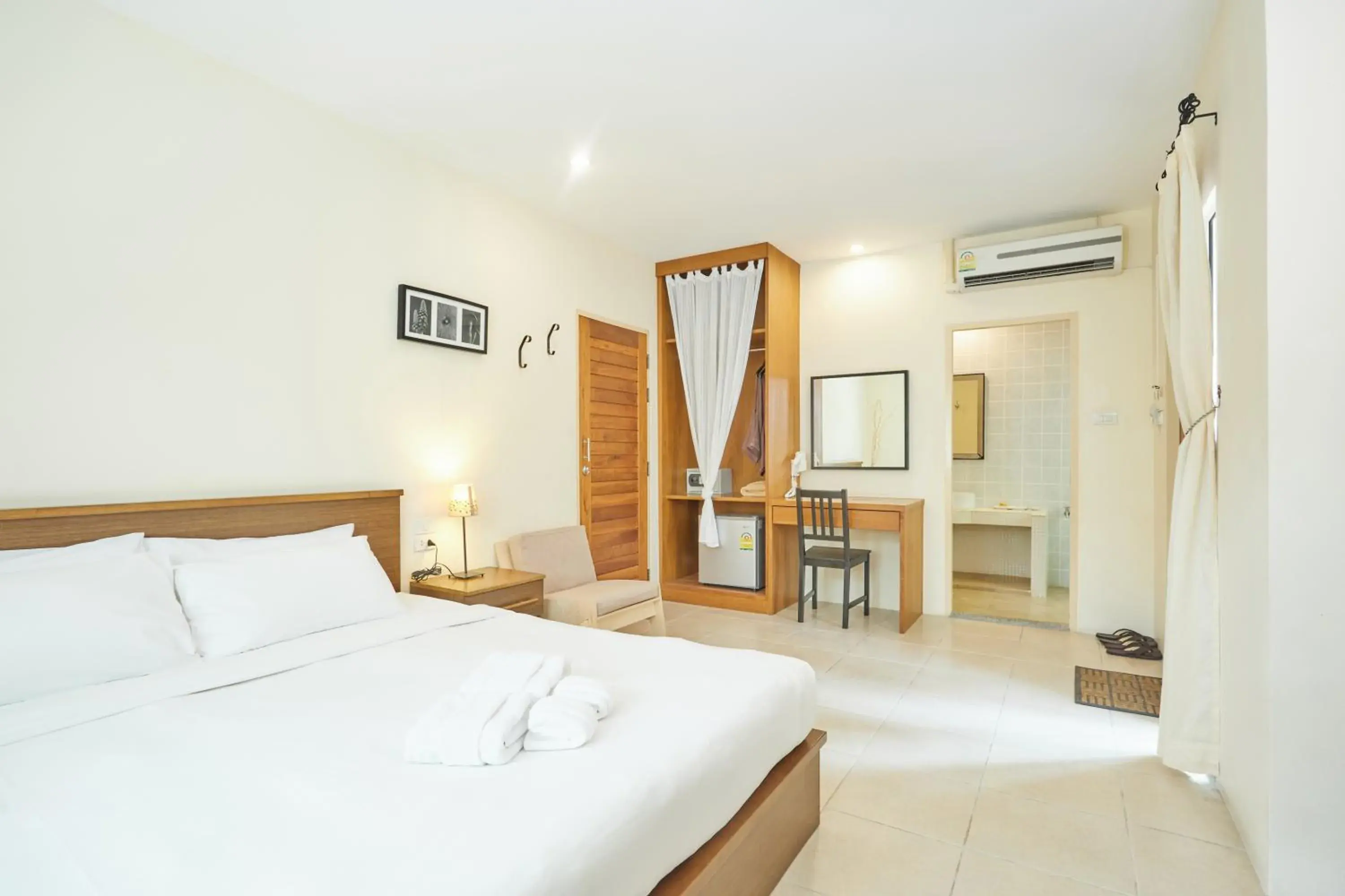 Bed in Talay Hotel & Villa