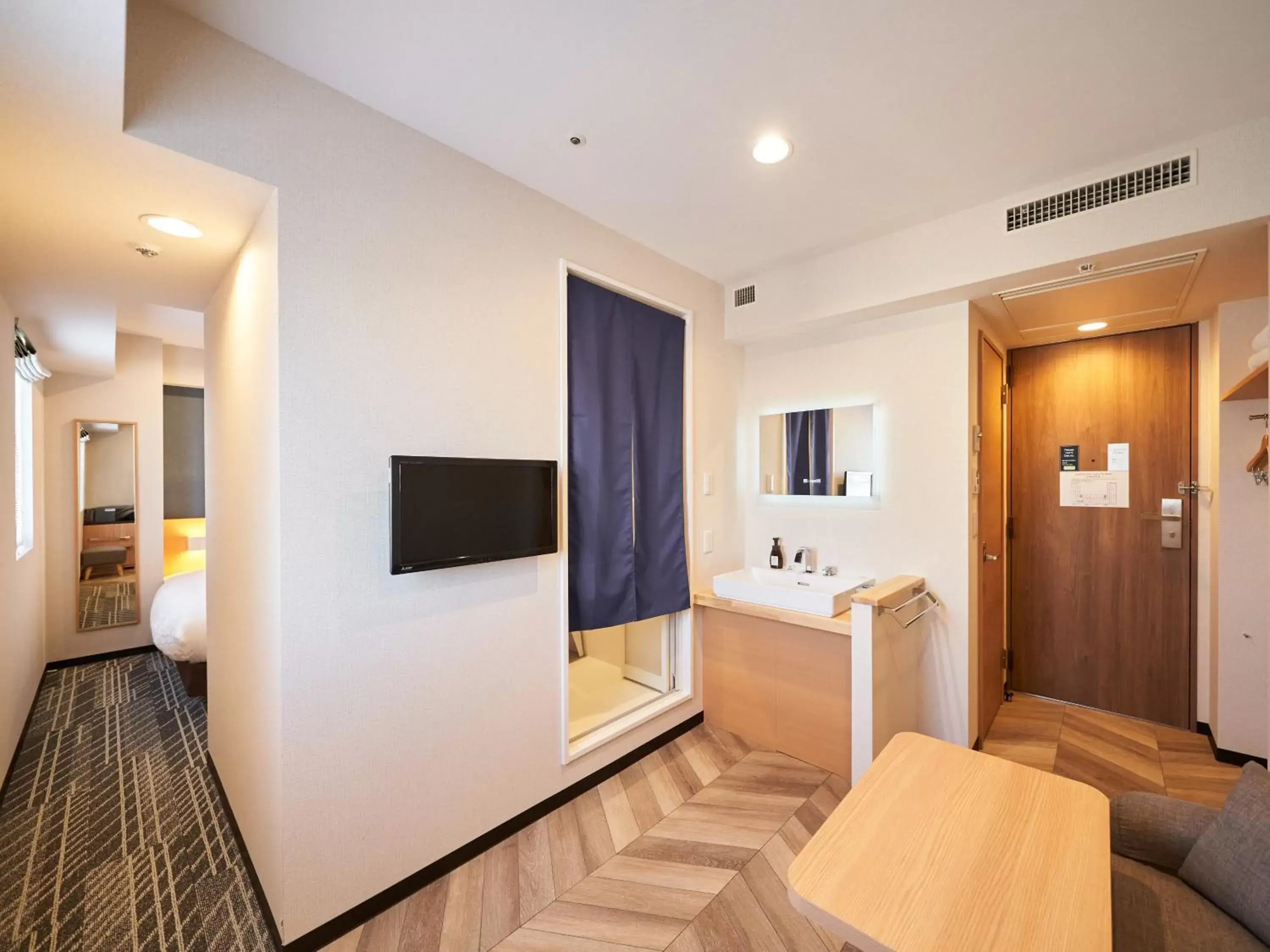 Living room, TV/Entertainment Center in WeBase TAKAMATSU