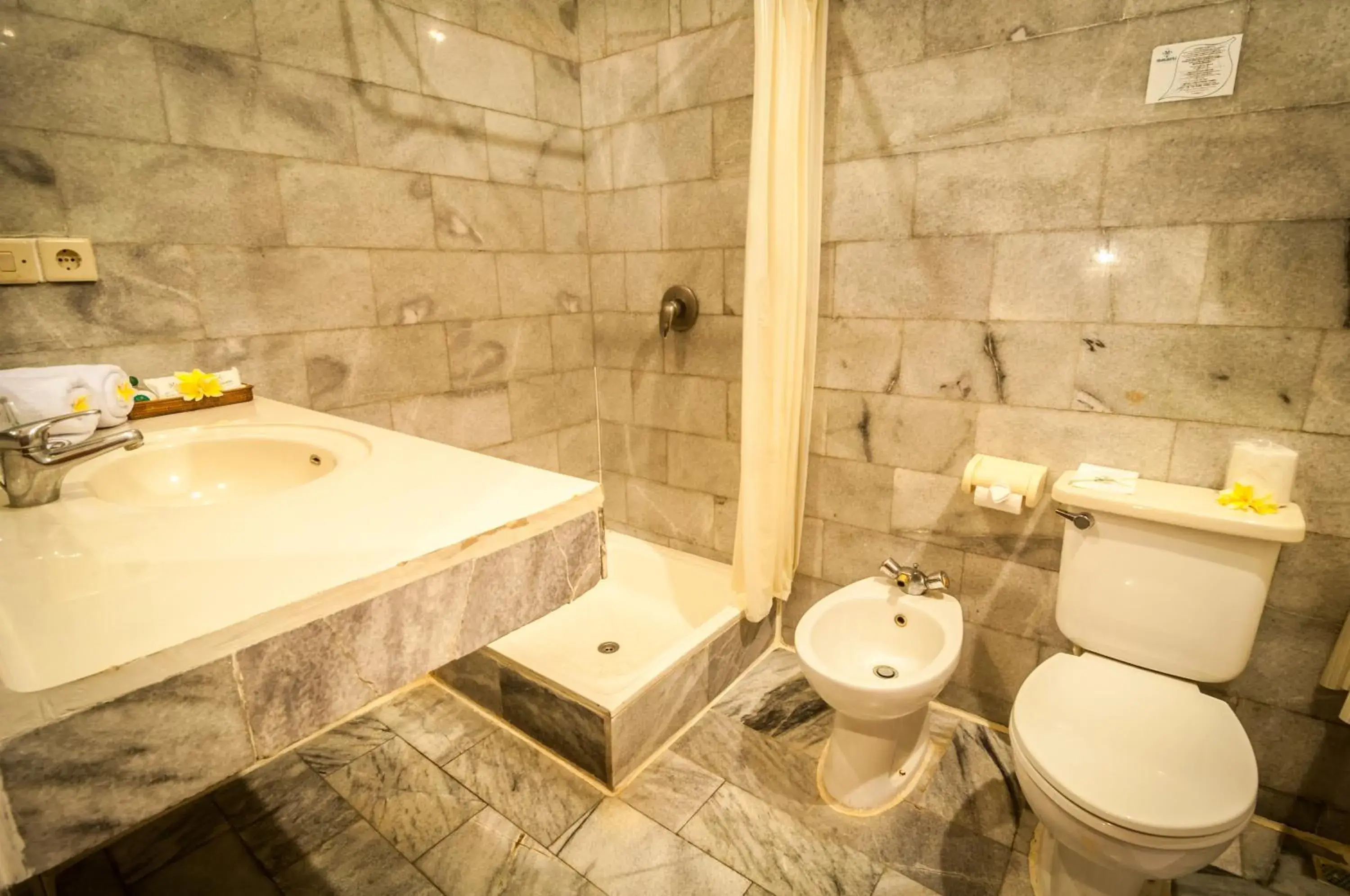 Bathroom in Melasti Kuta Bungalows & Spa