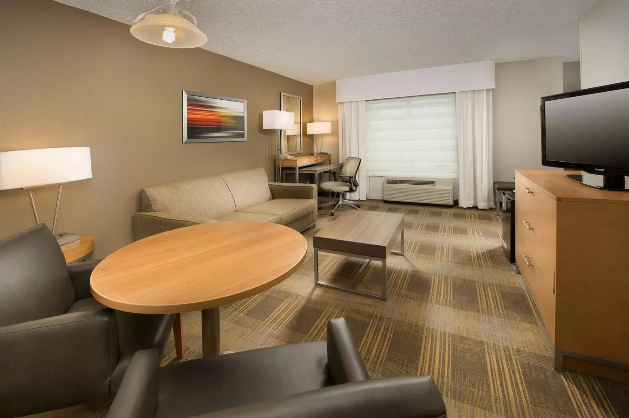 Bedroom, Seating Area in Holiday Inn Miami-Doral Area, an IHG Hotel