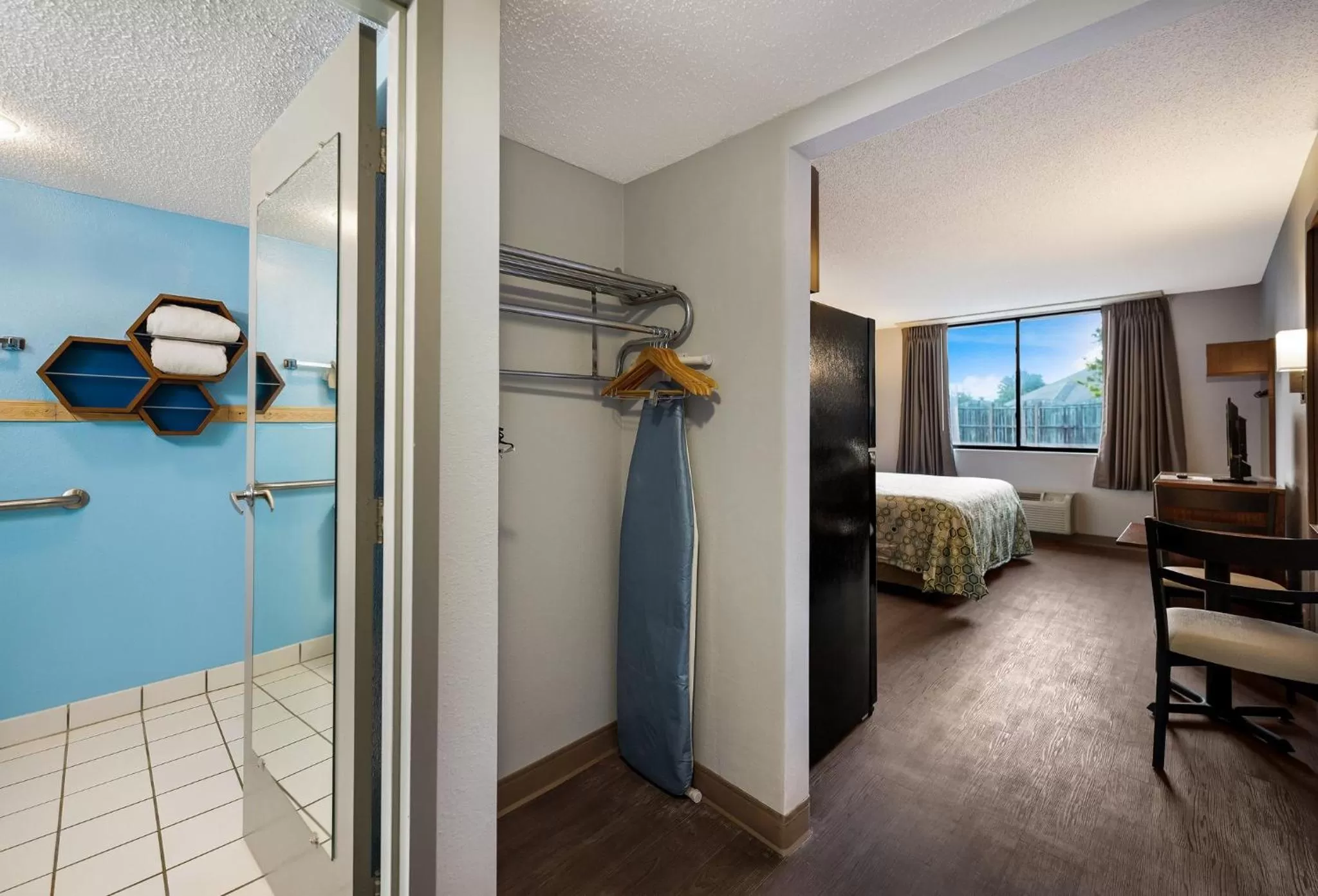 Photo of the whole room, Bed in HomeTowne Studios by Red Roof Painted Post