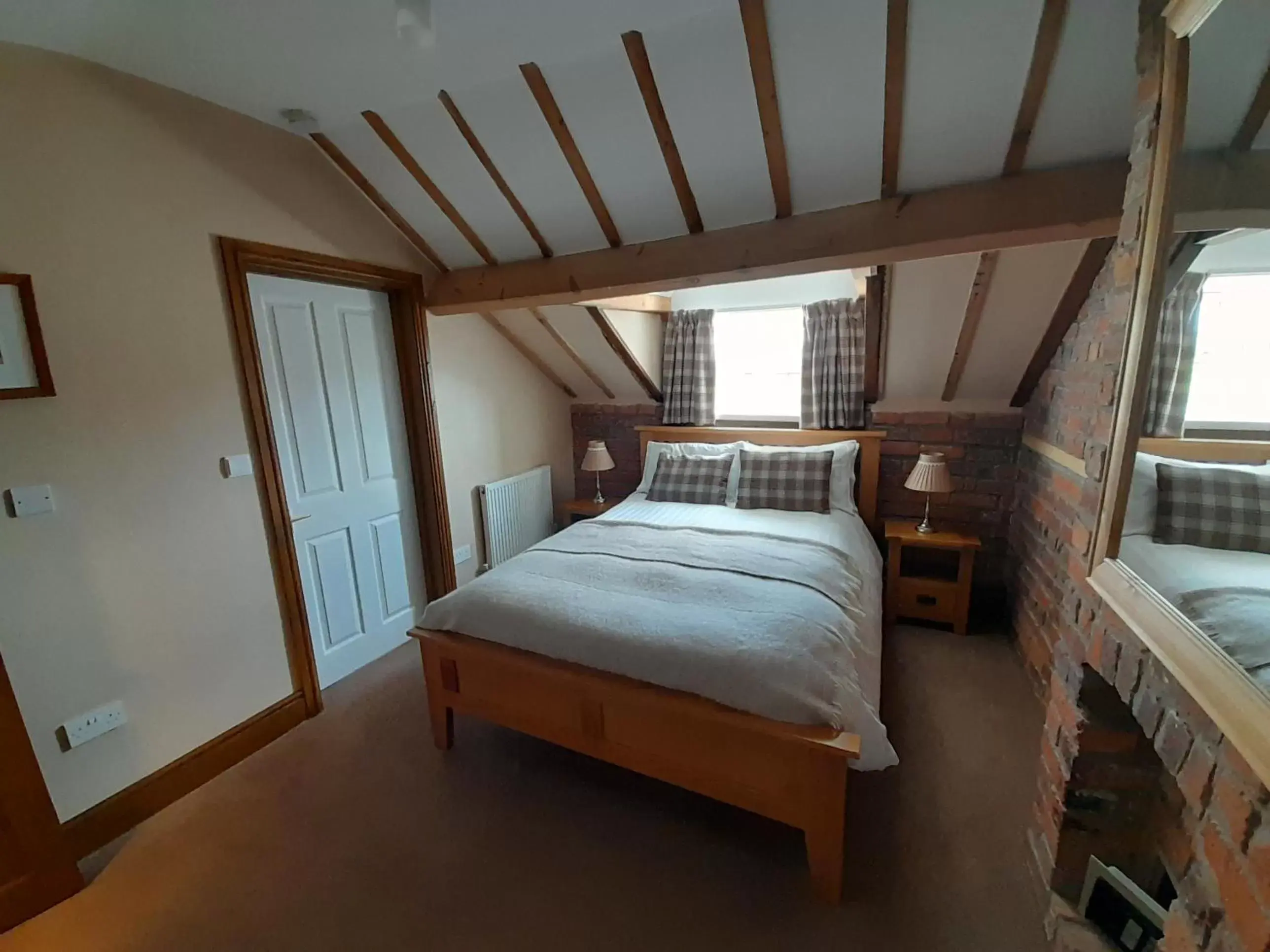Bed in The Dolfor Inn