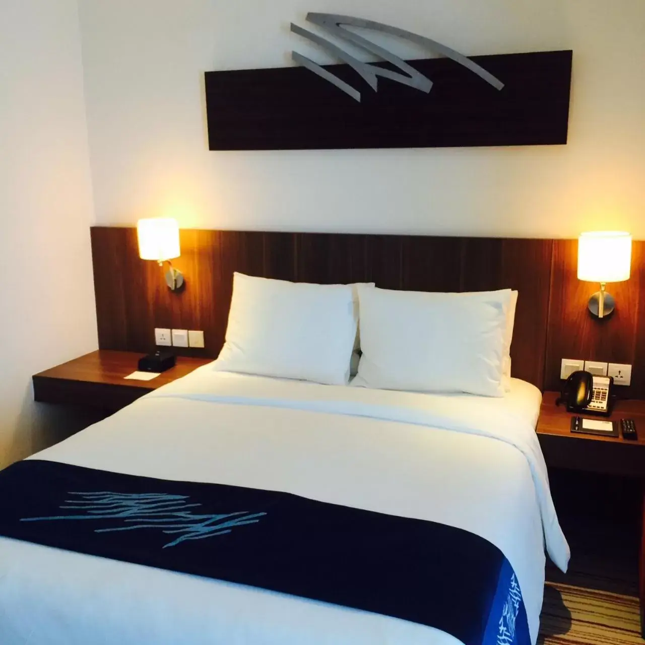 Bed in Holiday Inn Express Jakarta Pluit Citygate, an IHG Hotel