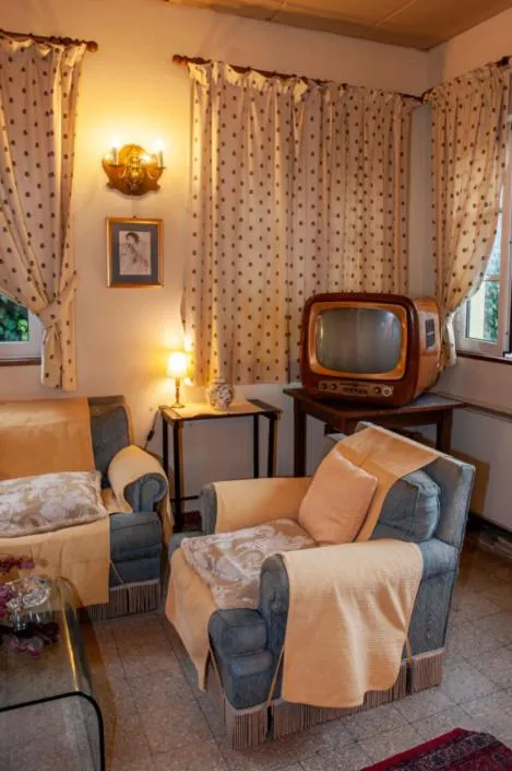 Communal lounge/ TV room, Bed in Hotel Melecchi