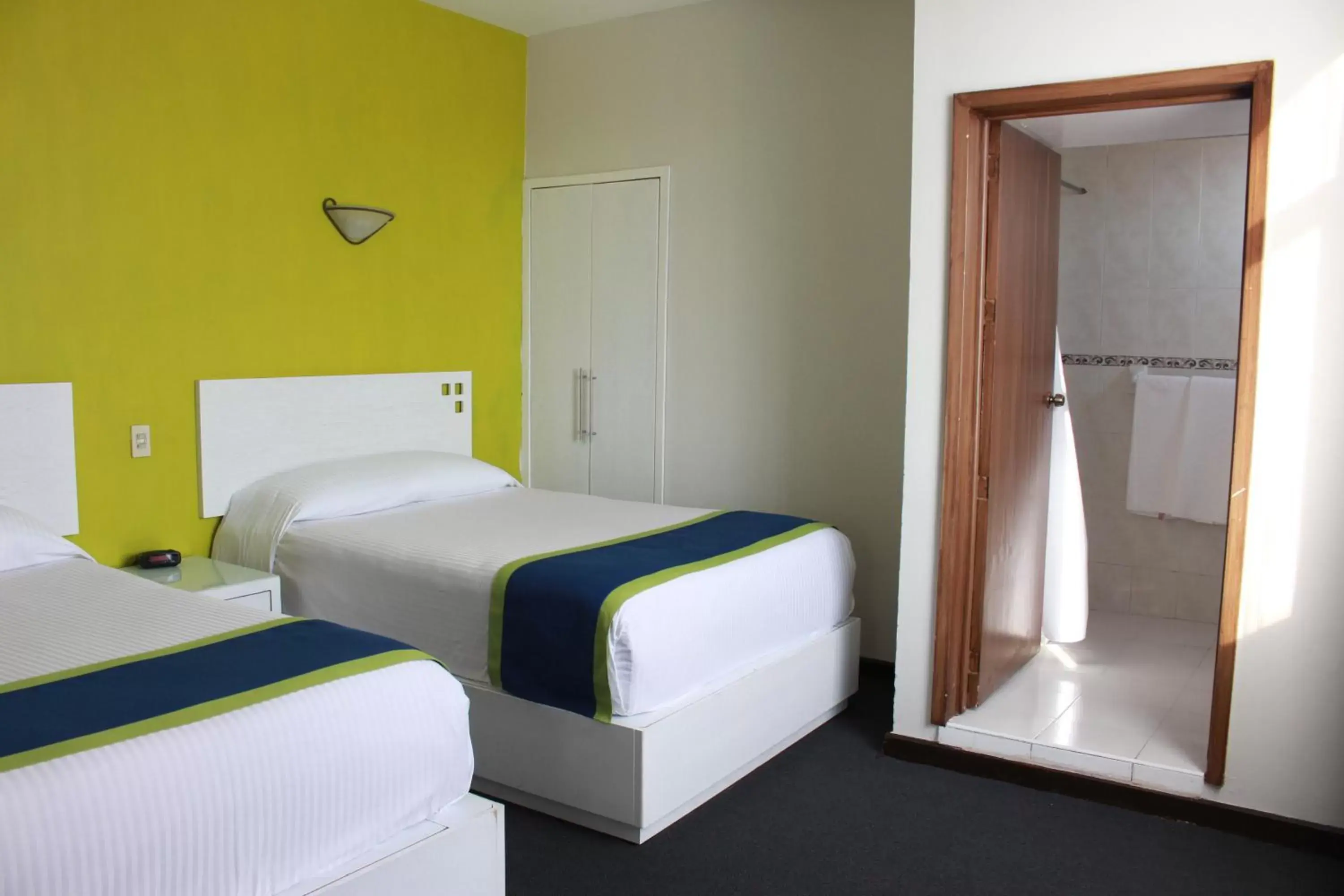 Photo of the whole room, Bed in Vista Express Morelia by Arriva Hospitality Group