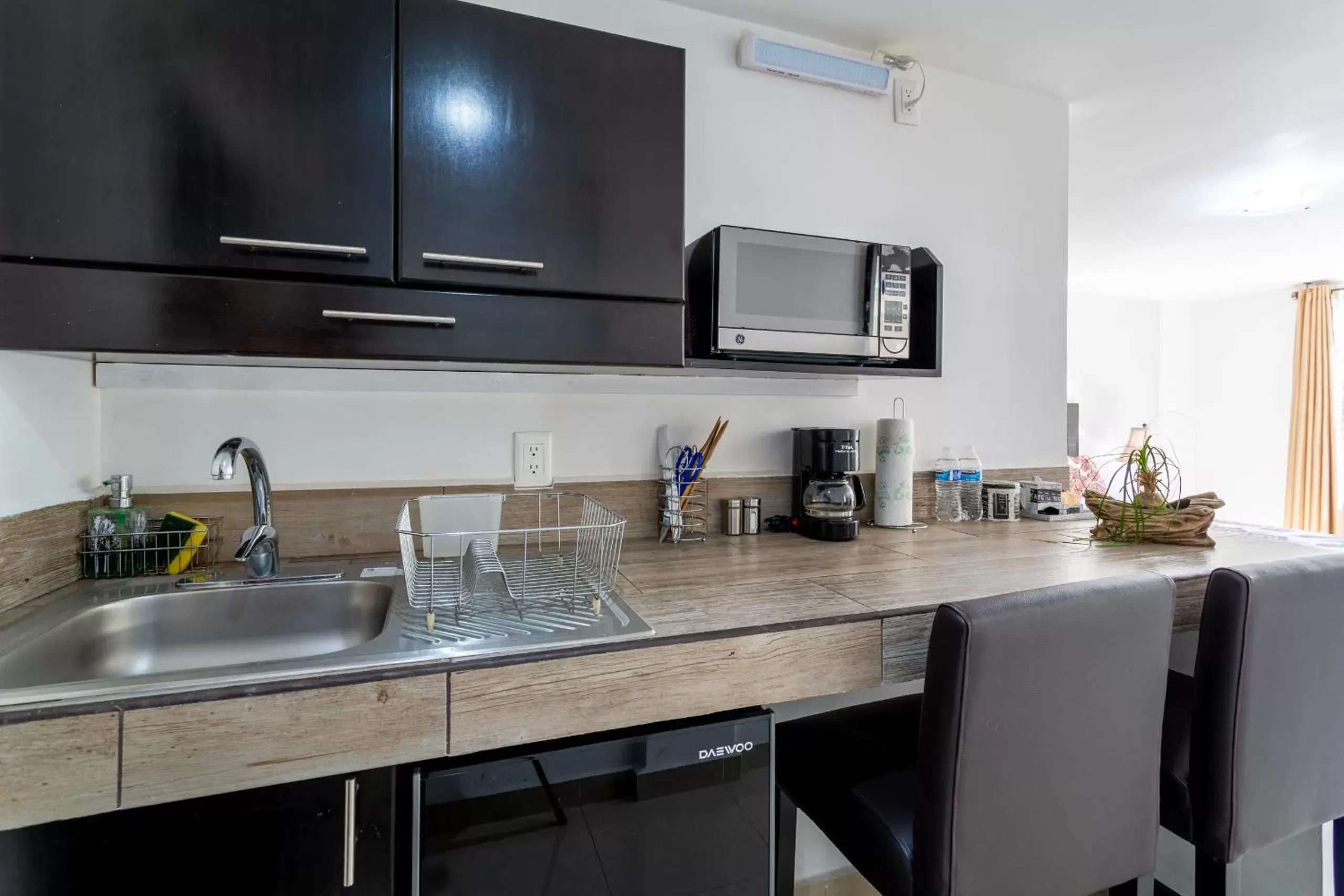 Kitchen/Kitchenette in Suites 259 Condesa