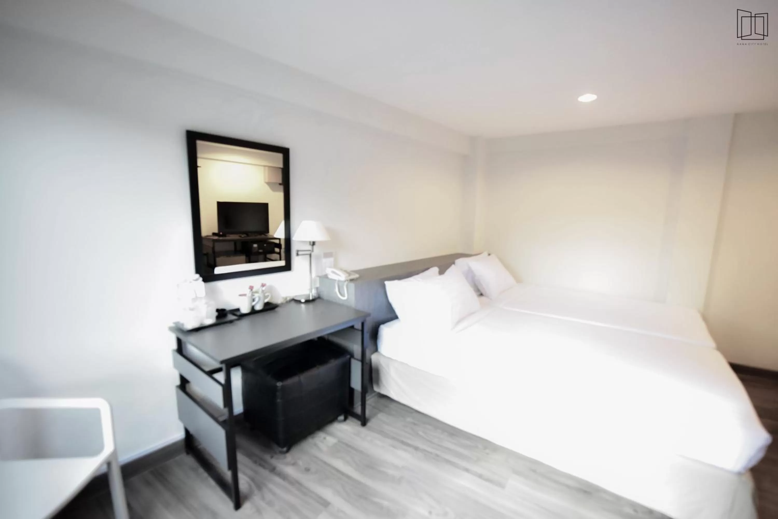 Bed in Nana City Hotel