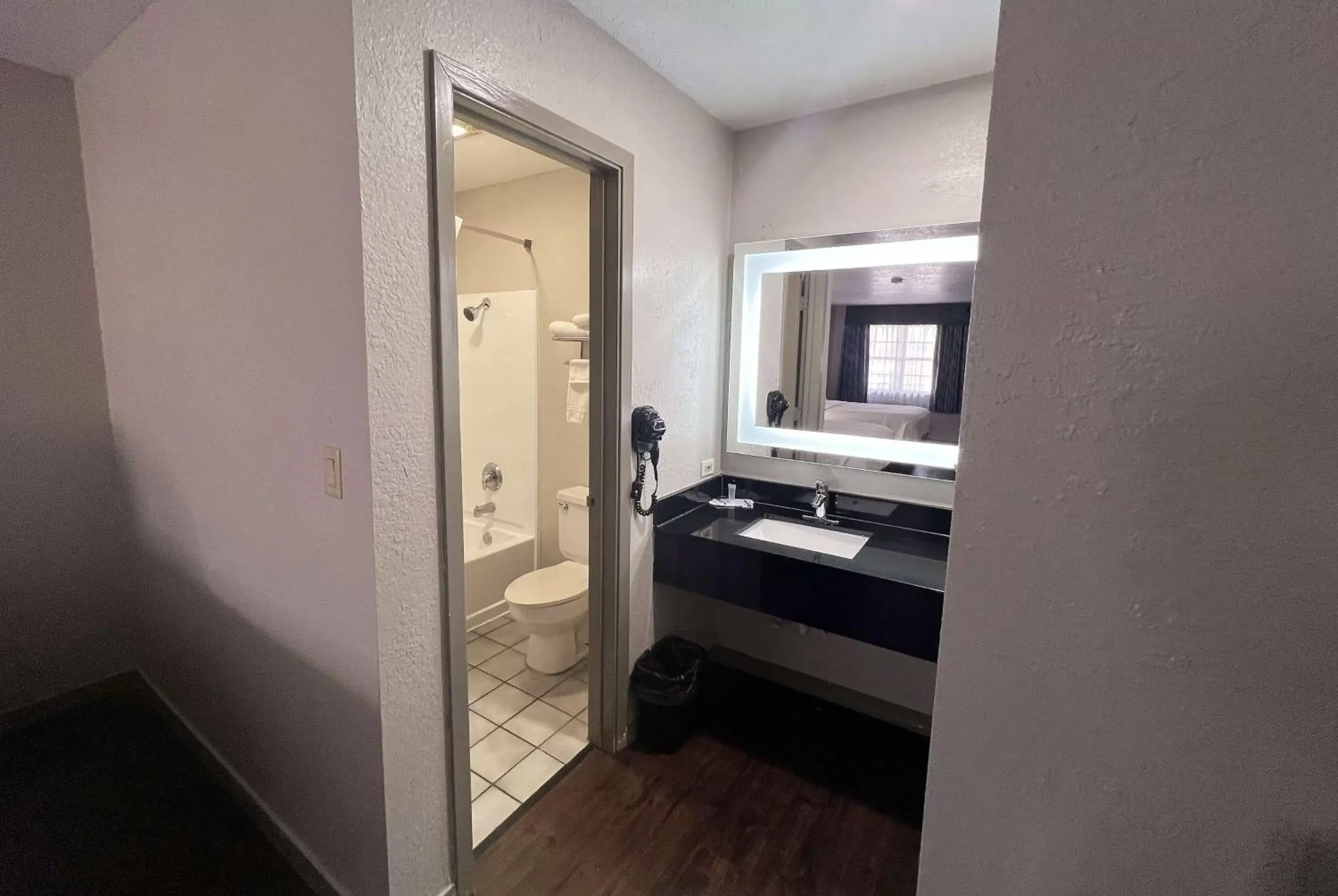 TV and multimedia, Bathroom in Days Inn & Suites by Wyndham - Canton First Monday Trade Days