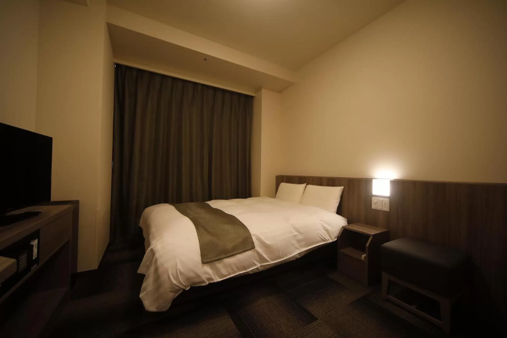 Bed in Dormy Inn Korakuen