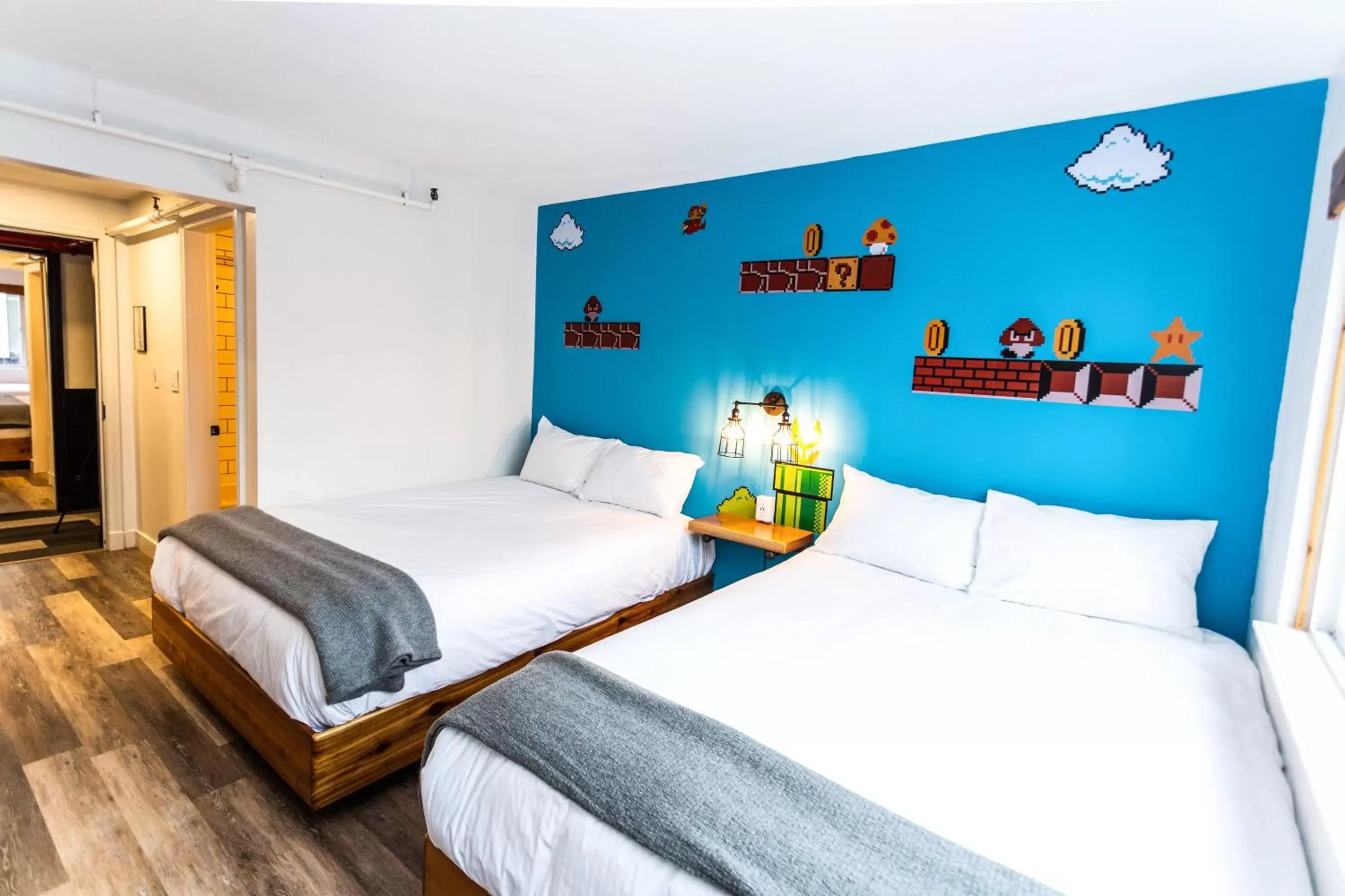 Party Room, 2 Queen Beds, 2 Twin Bunks (Above LOUD Pub) in Crash Hotel Squamish Party Room, 2 Queen Beds, 2 Twin Bunks (Above LOUD Pub) in Crash Hotel Squamish