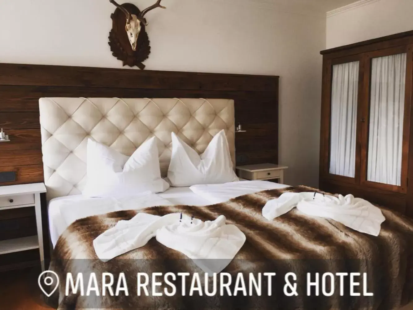 Bed in Mara Restaurant & Hotel