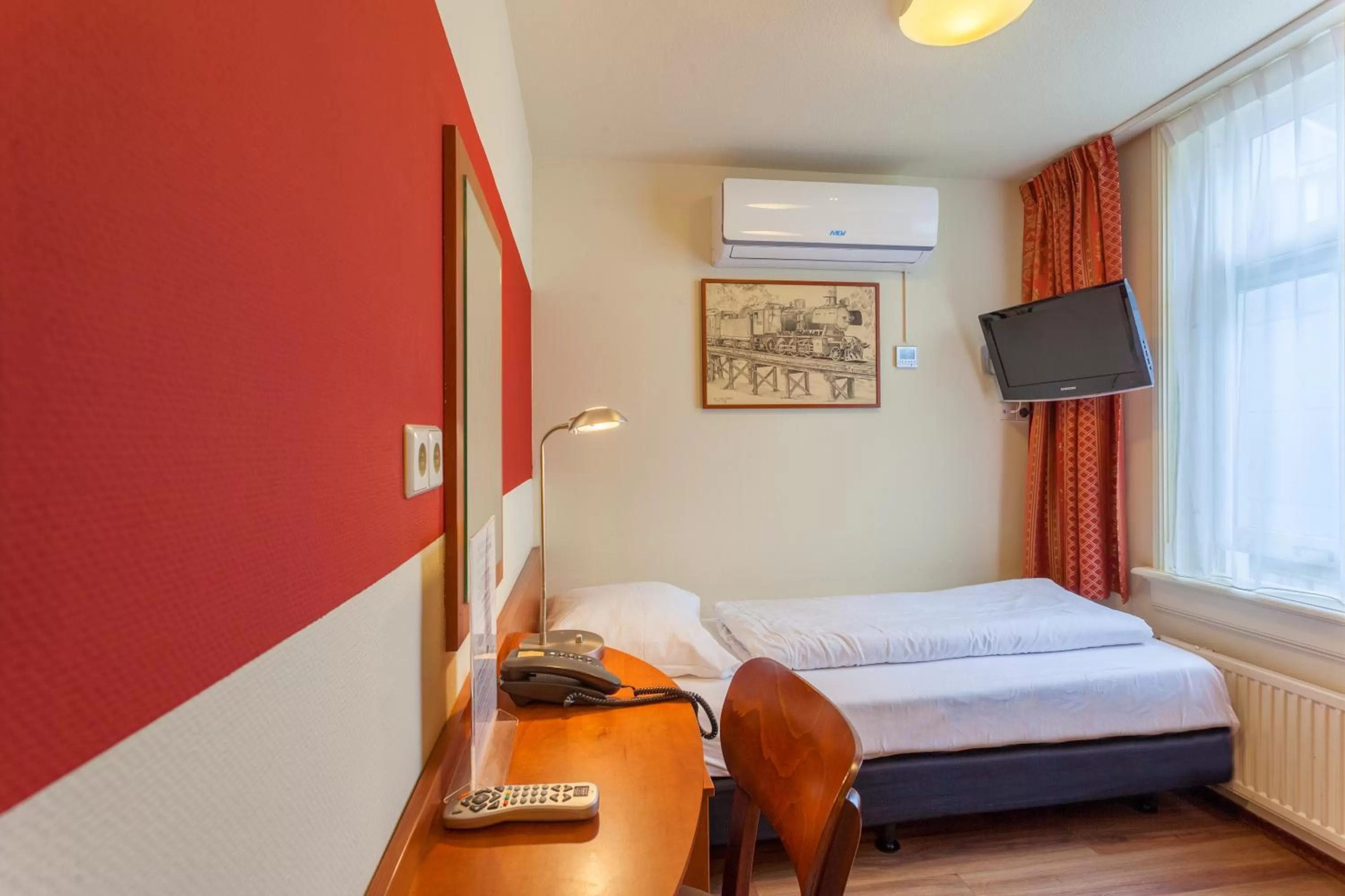 Bed in A-Train Hotel