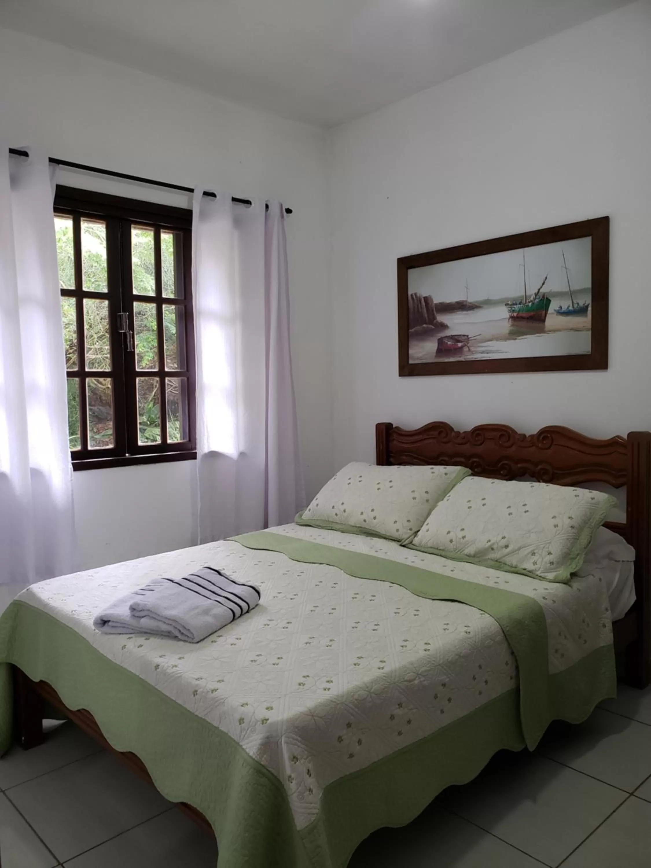 Bed in Pousada Recanto Das Emerências