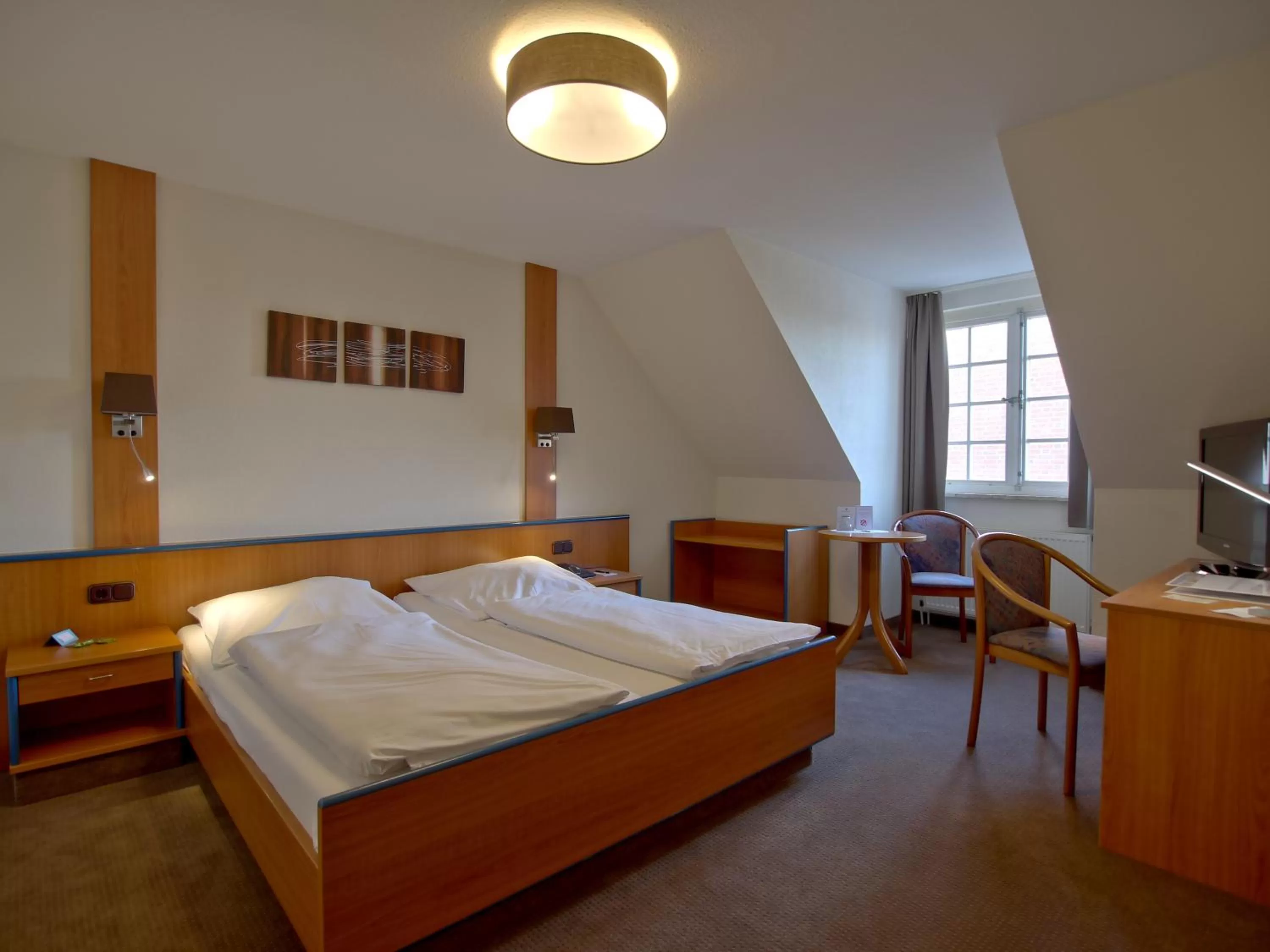 Bed in Hotel Friesische Wehde