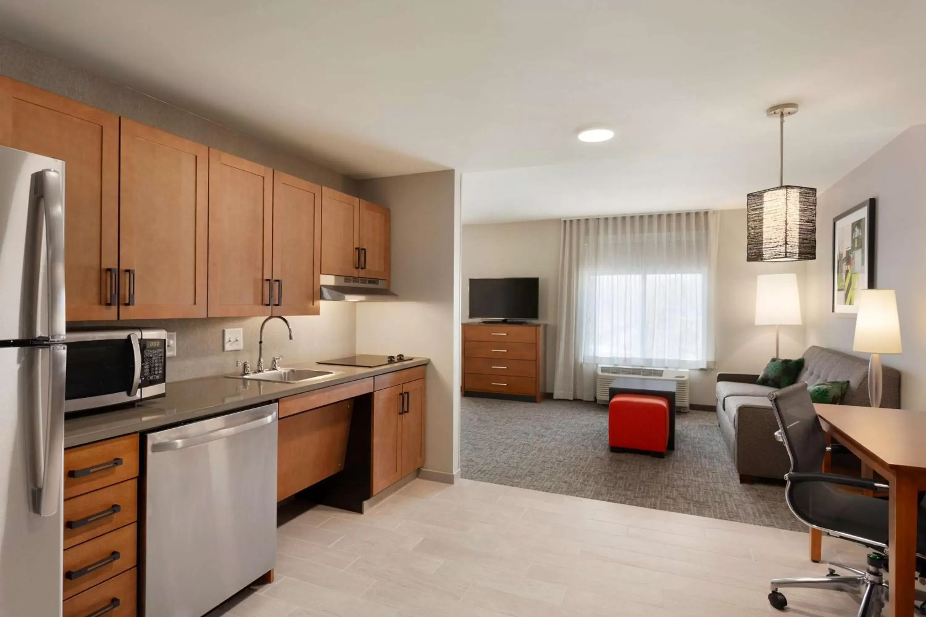 Bed, Kitchen/Kitchenette in Homewood Suites by Hilton Syracuse - Carrier Circle