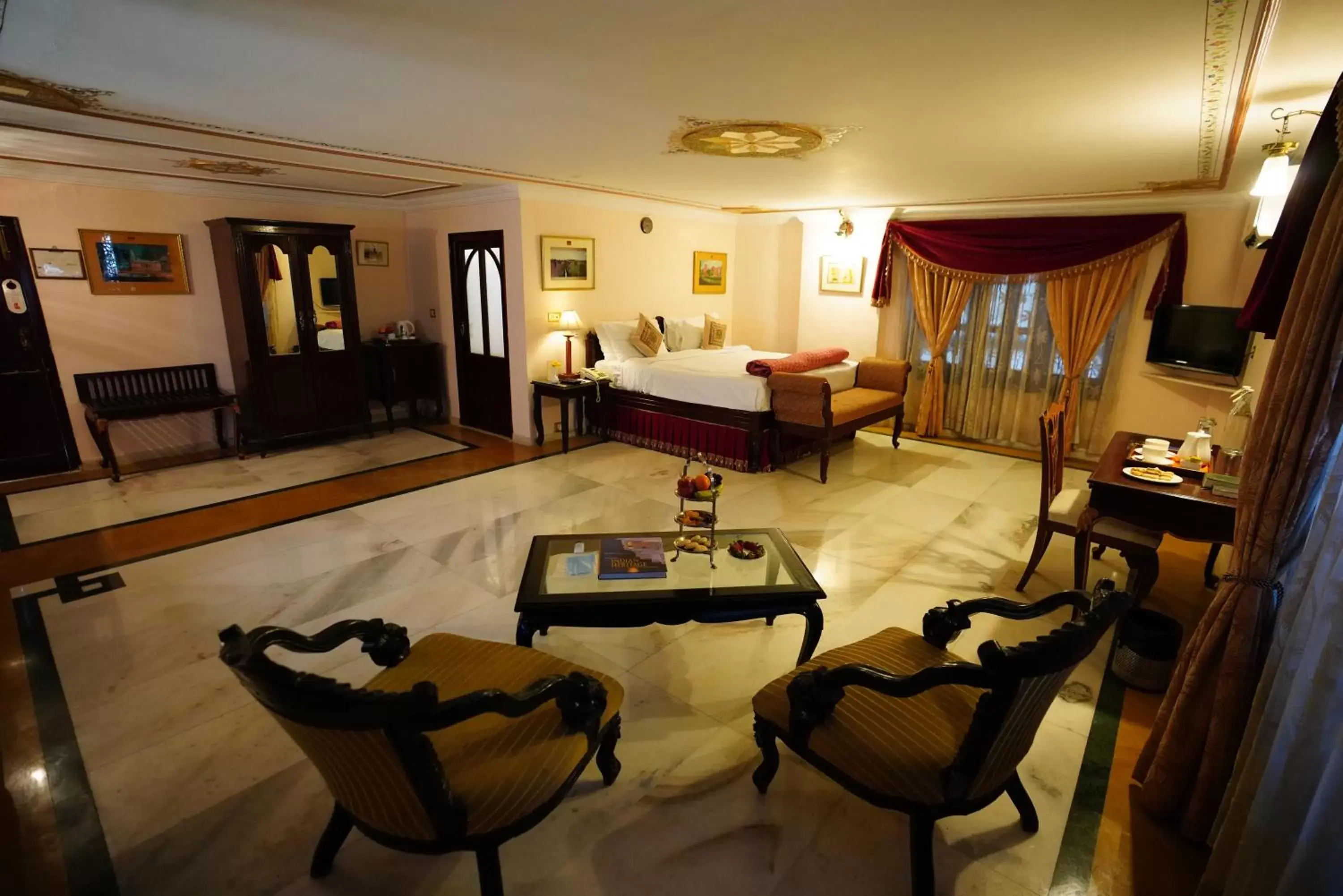 Bed, Seating Area in The Laxmi Niwas Palace