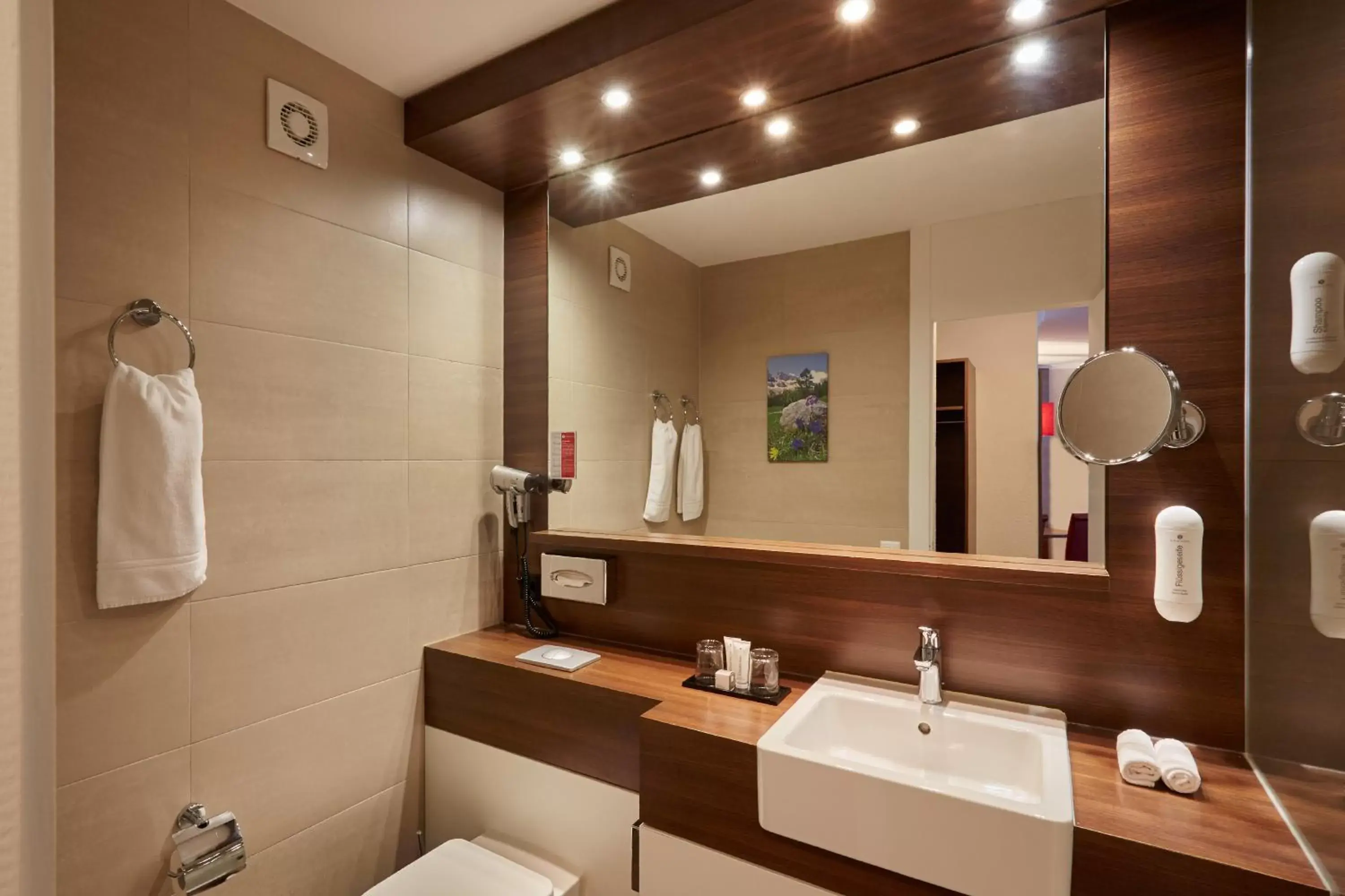 Bathroom in H+ Hotel & SPA Engelberg Bathroom in H+ Hotel & SPA Engelberg