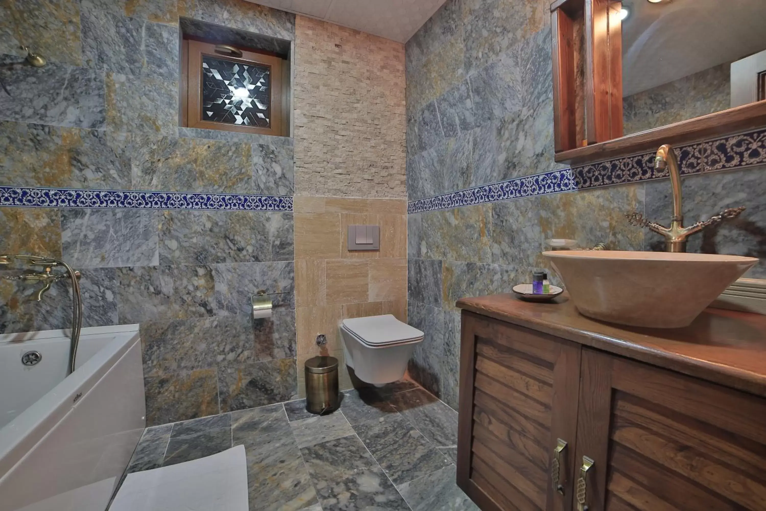 Toilet, Bathroom in Caravanserai Inn Hotel