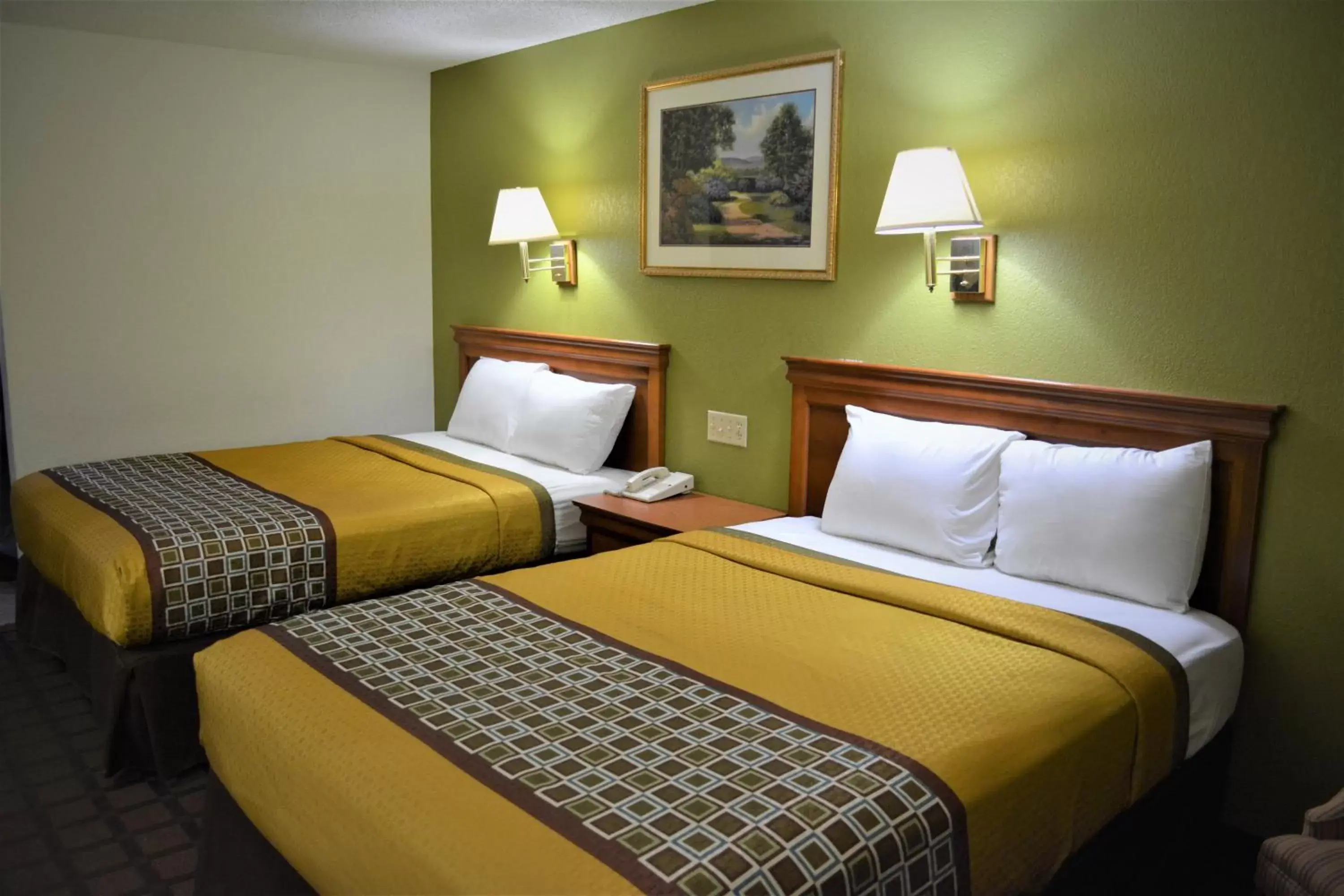 Bed in Bloomer Inn & Suites