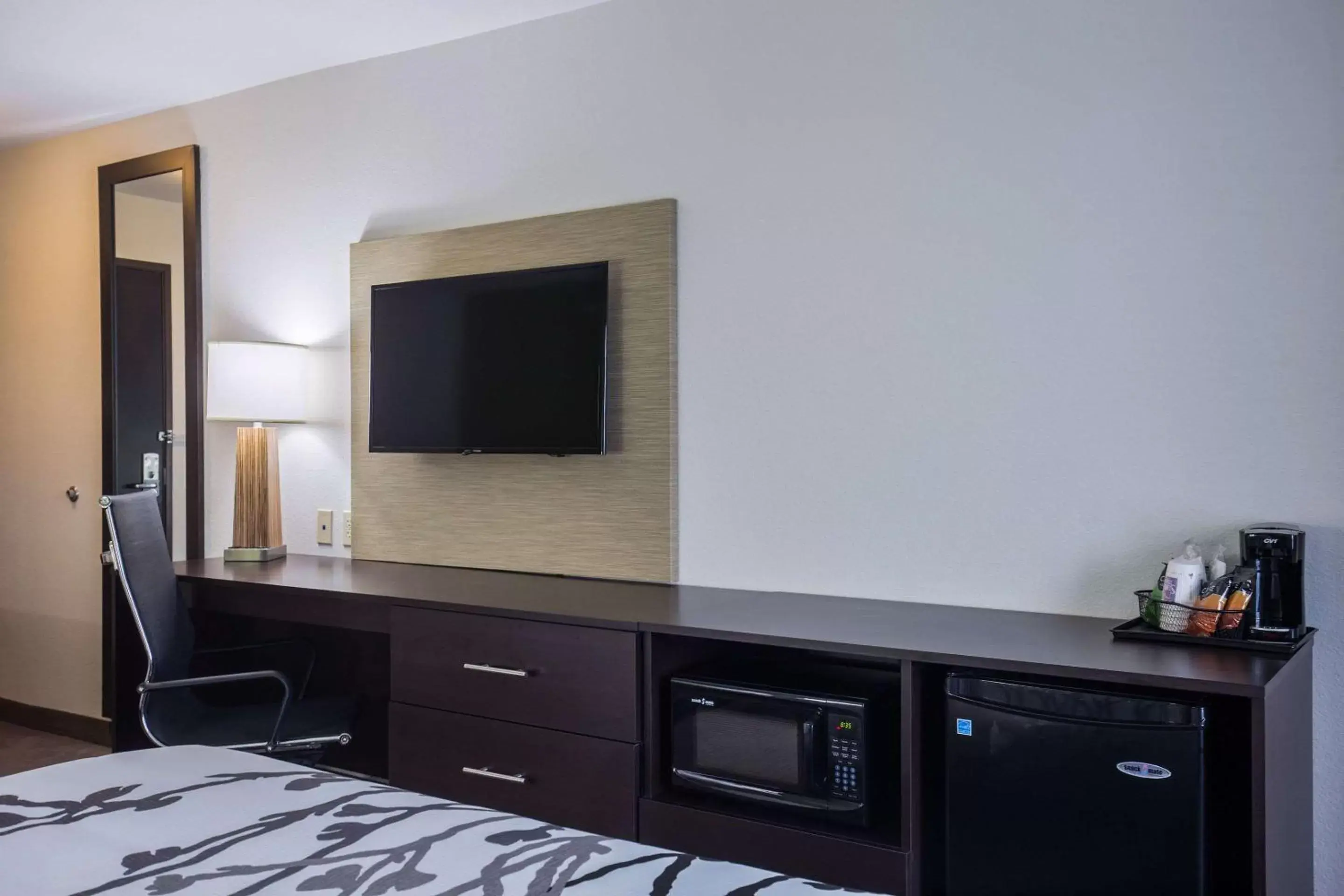 Photo of the whole room, TV/Entertainment Center in Sleep Inn & Suites