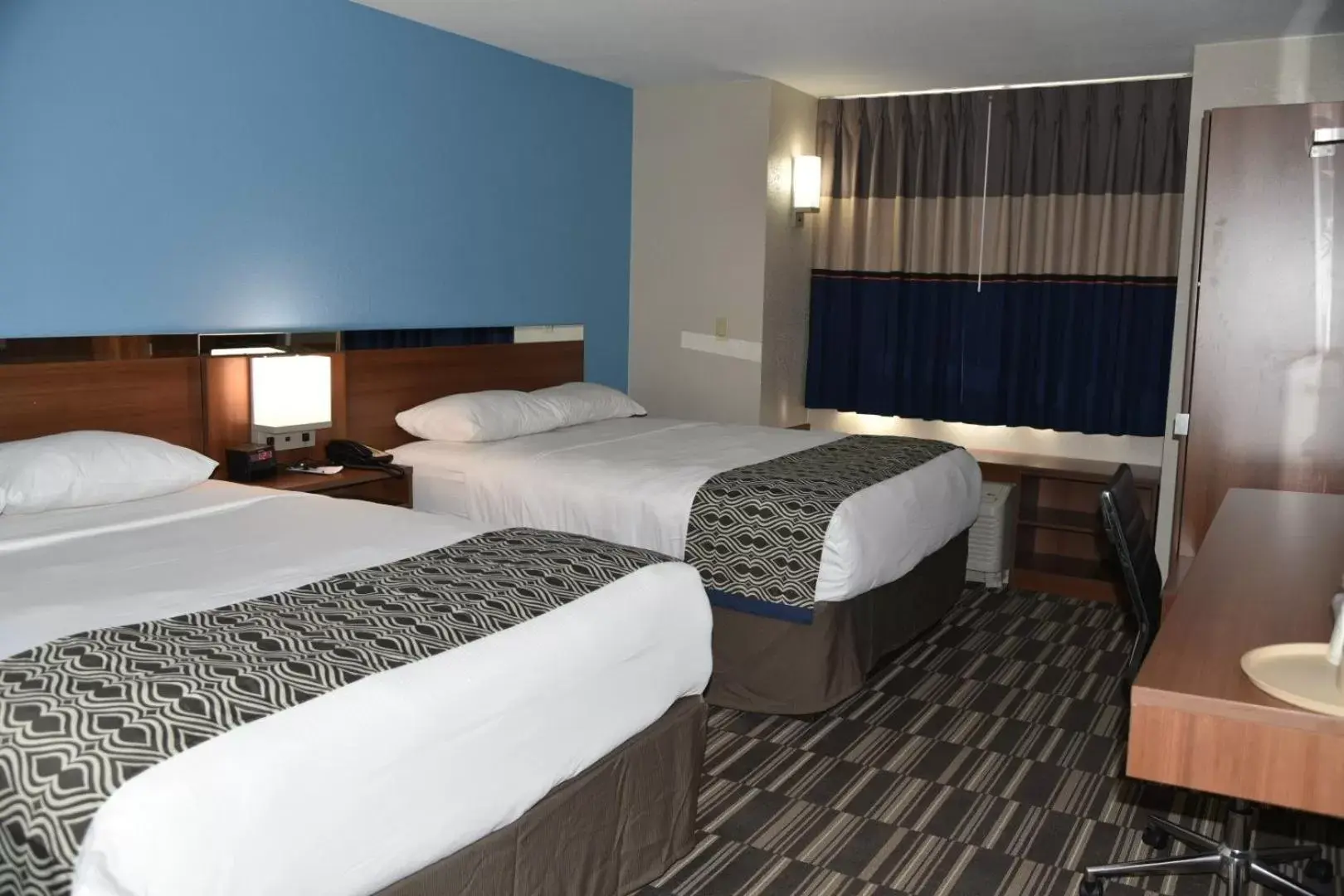 Bed in Microtel Inn & Suites by Wyndham Fond Du Lac