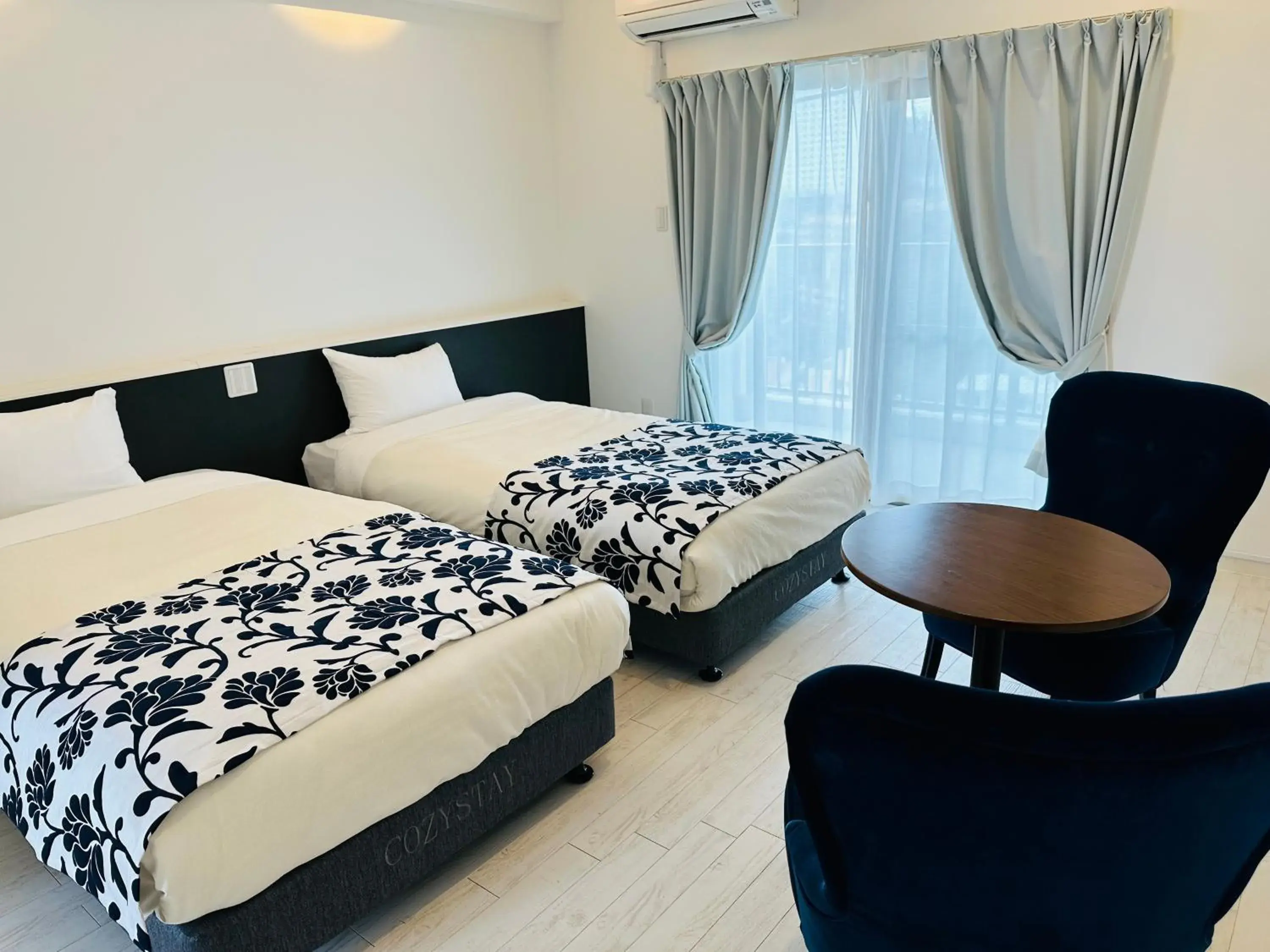 Bed in Cozy Stay in Naha