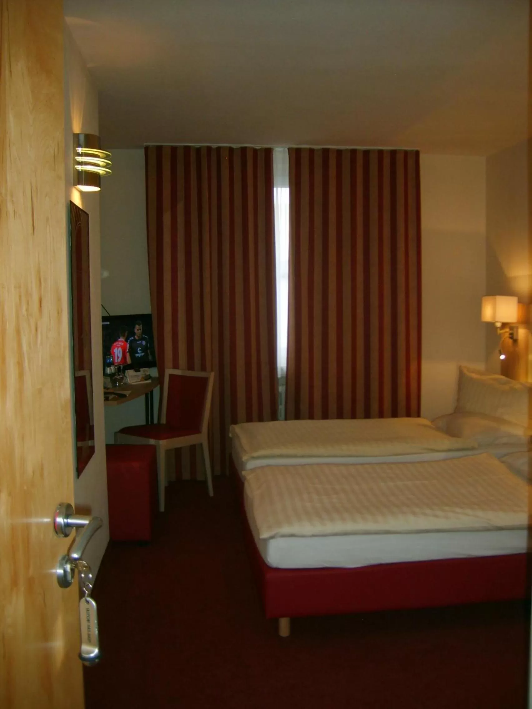 Photo of the whole room, Bed in City Hotel by celina