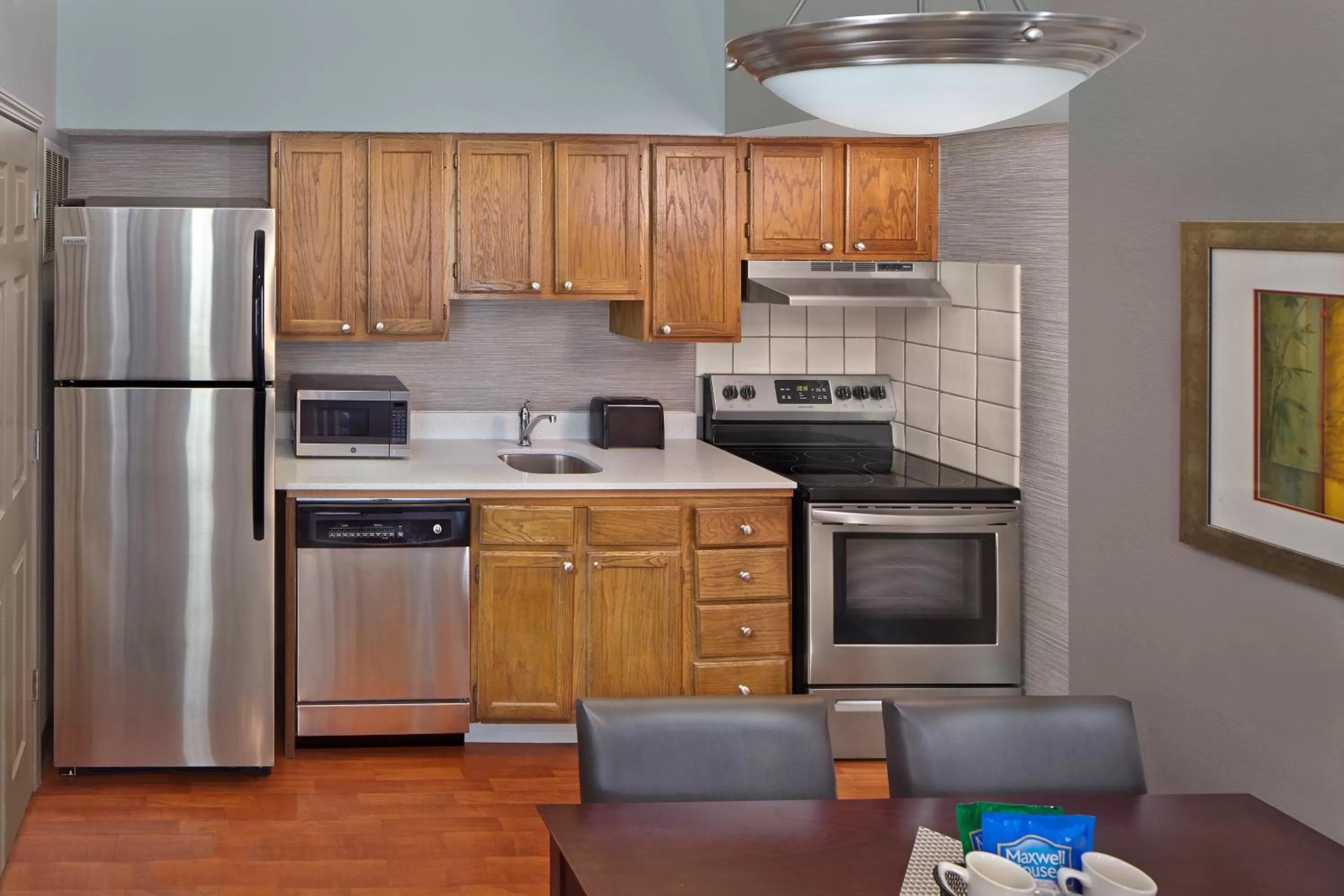 Kitchen or kitchenette in New Haven Village Suites