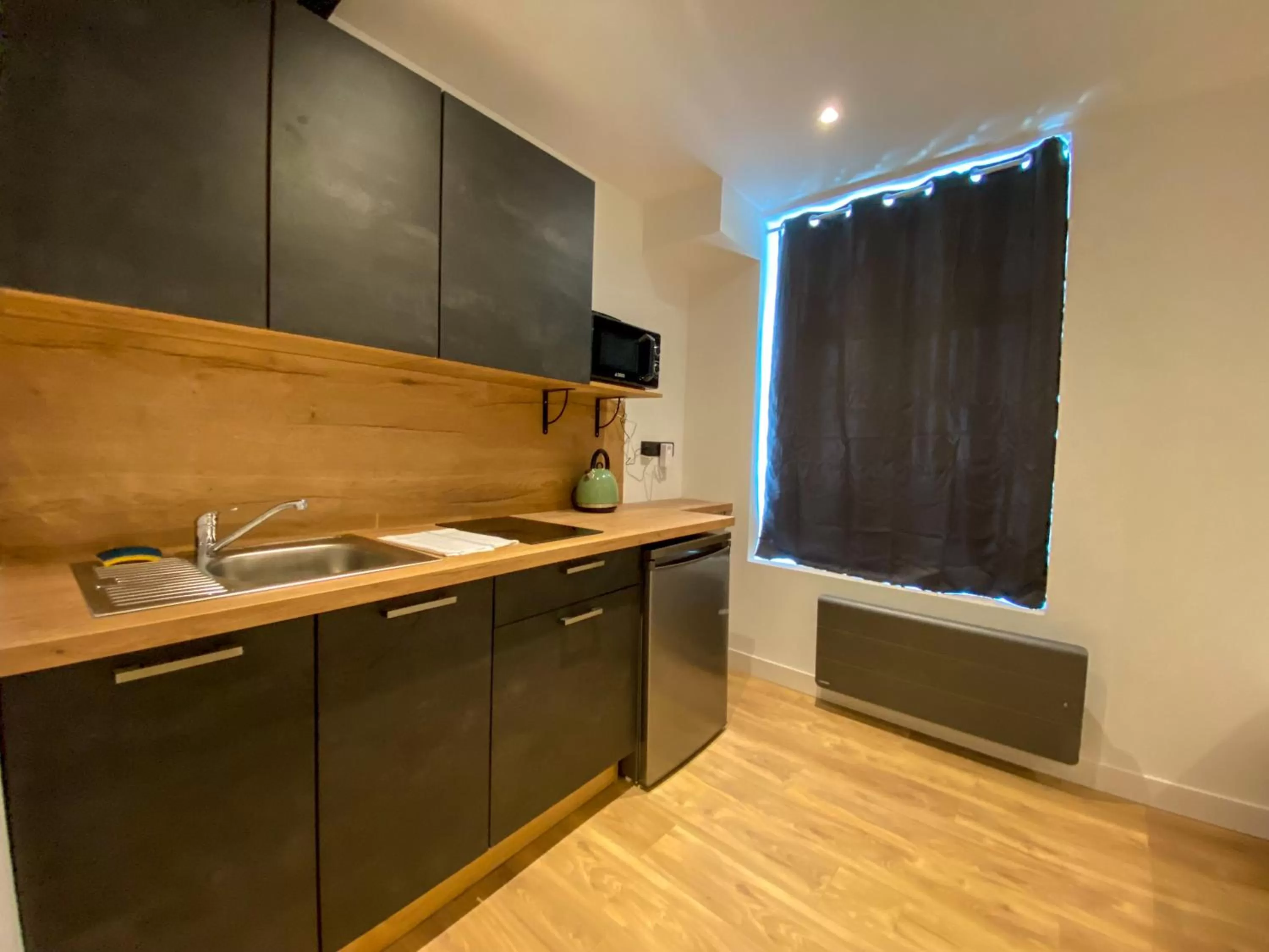 Kitchen/Kitchenette in Le Bras d'or Apparts et Spa