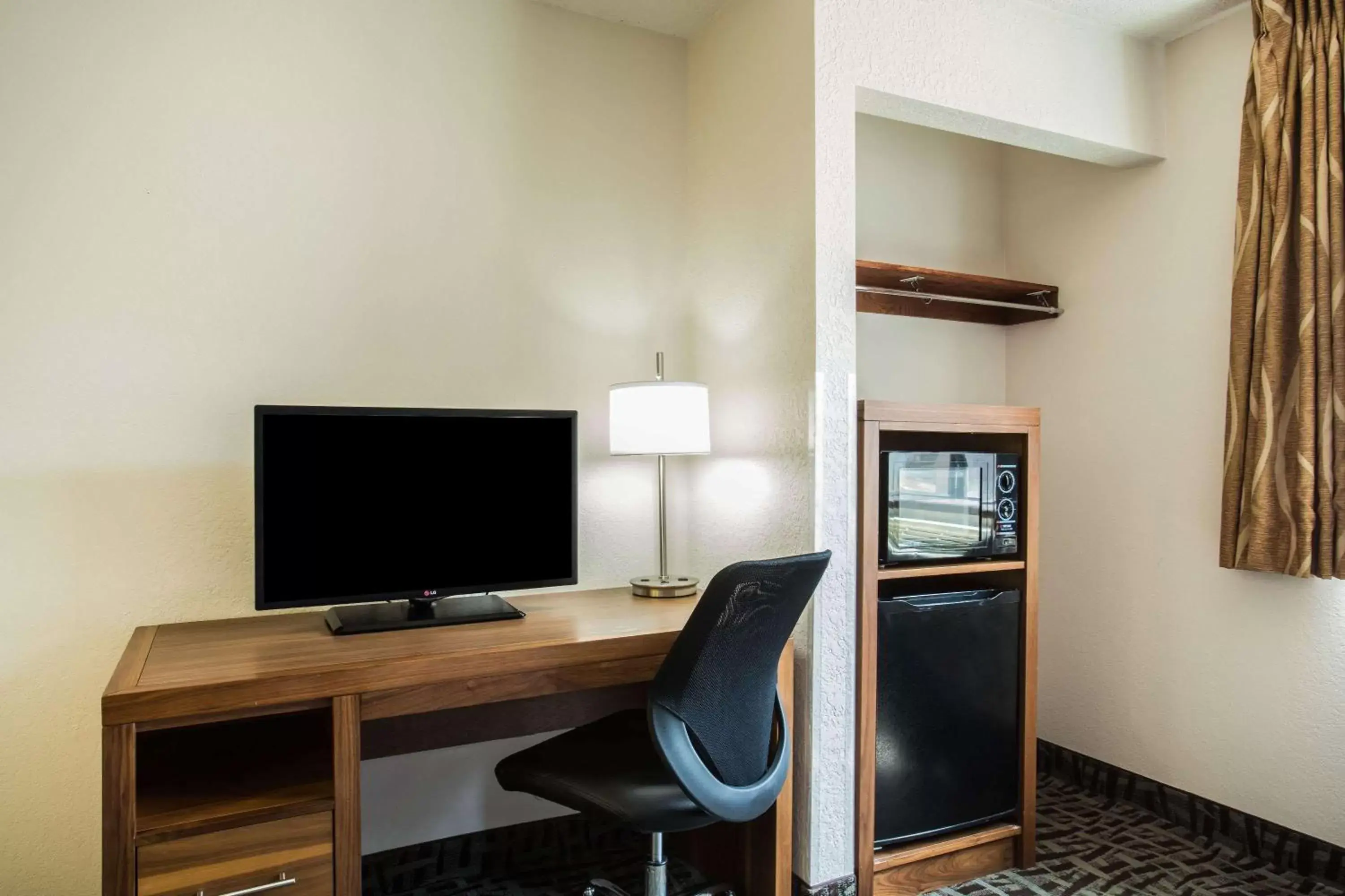 Photo of the whole room, TV/Entertainment Center in Super 8 by Wyndham Flagstaff