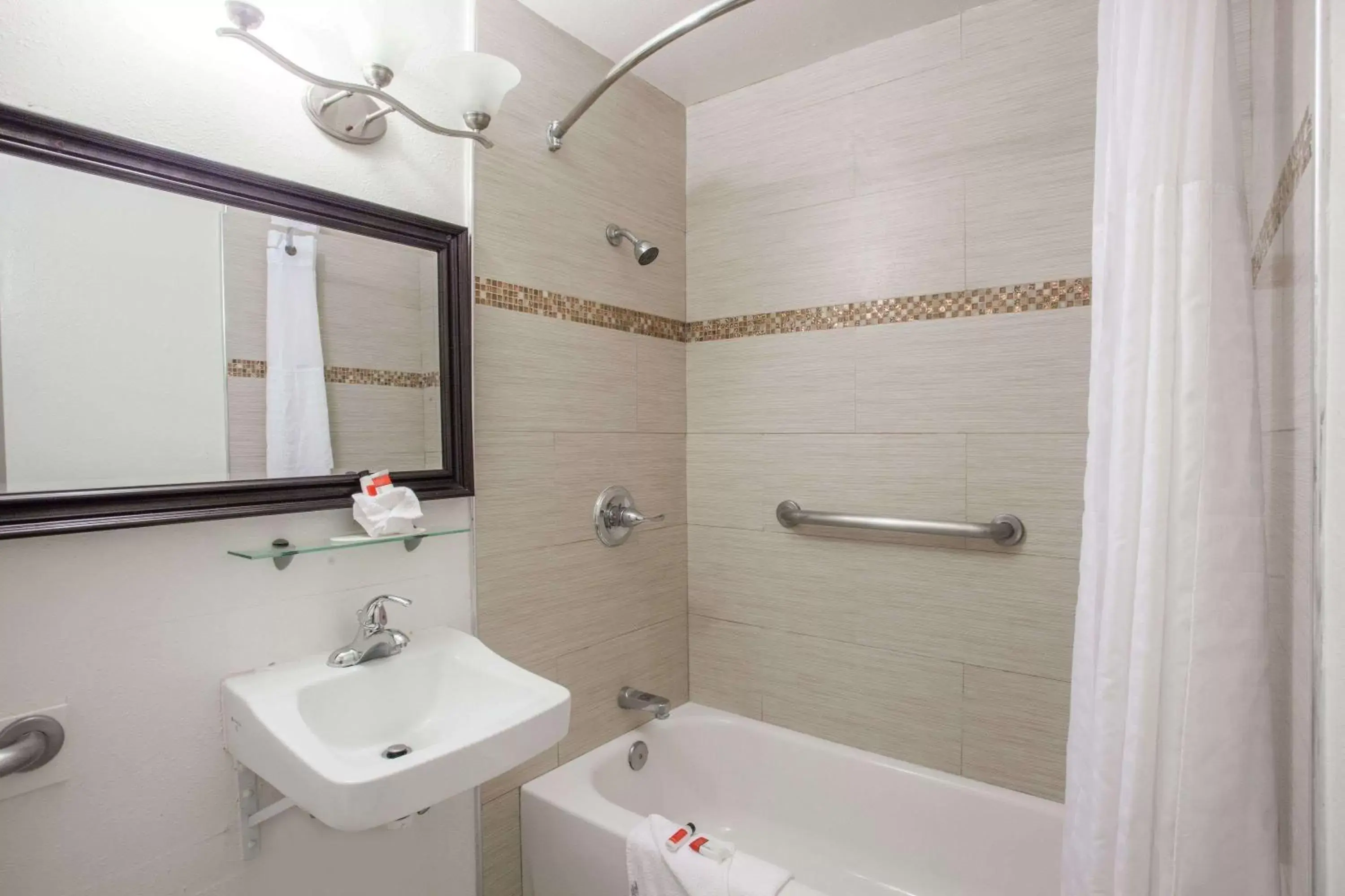 Bathroom in Days Inn by Wyndham Orange Anaheim