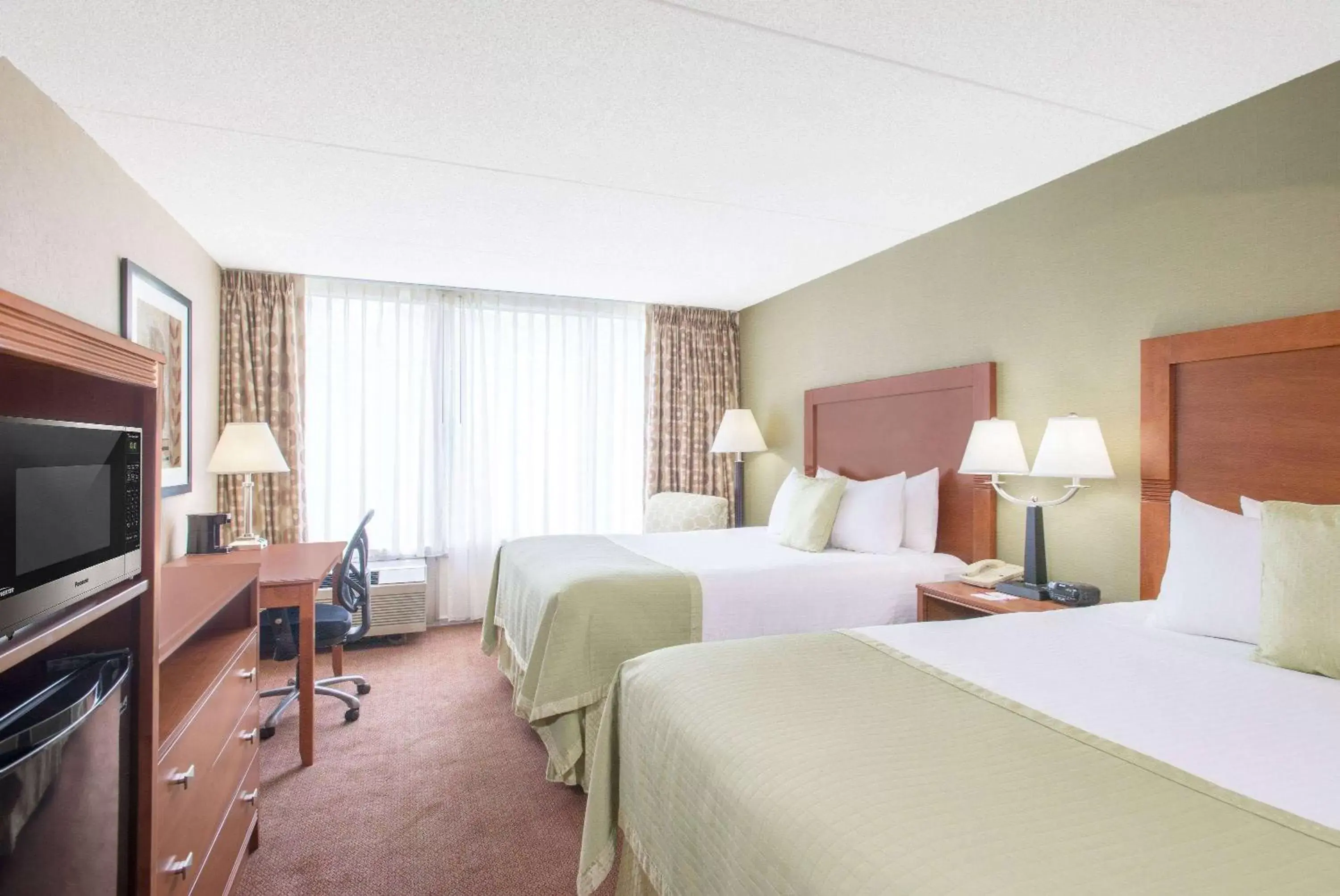 Photo of the whole room, Bed in Ramada by Wyndham Ellsworth - Bar Harbor