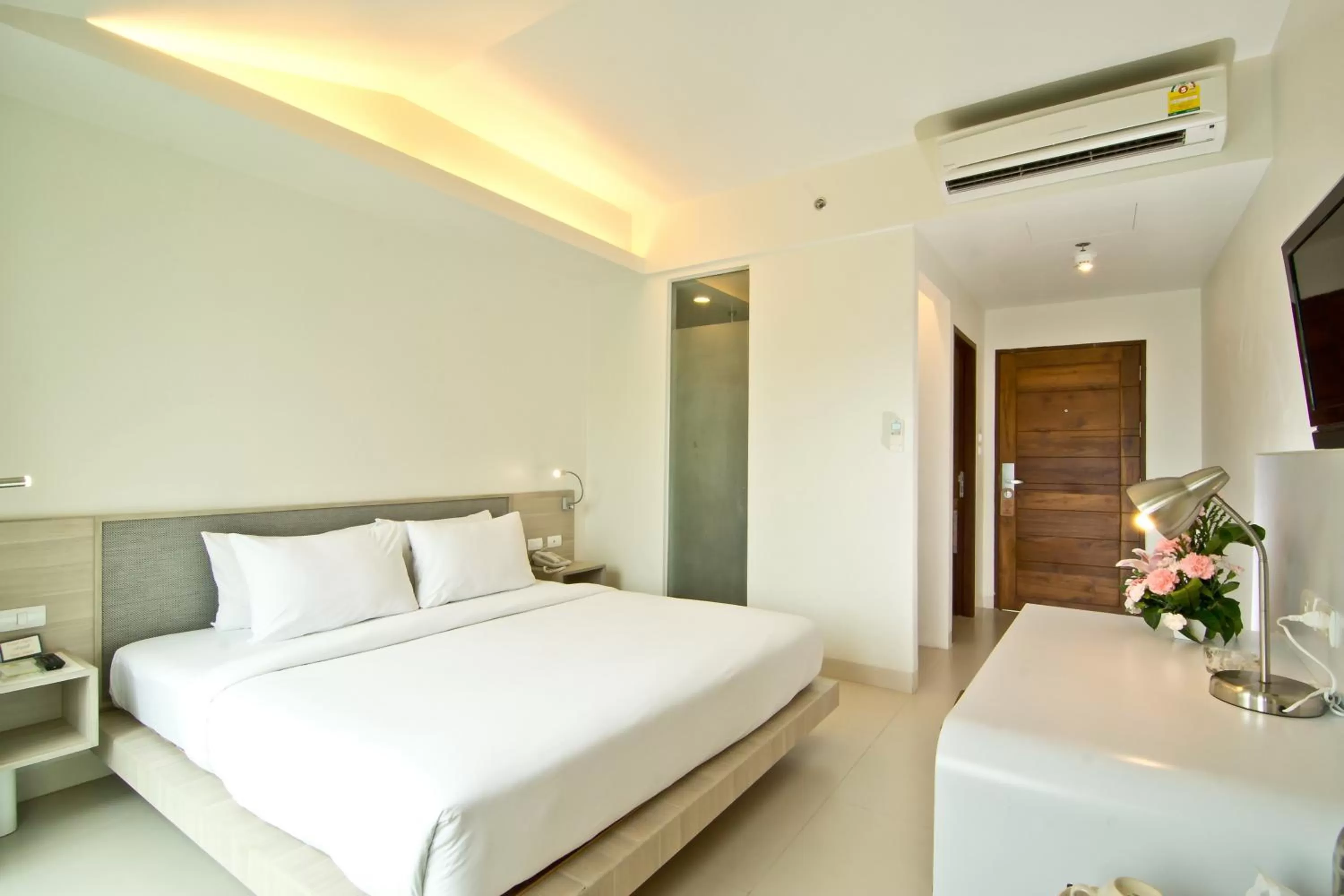 Bed in Sunshine Hotel & Residences