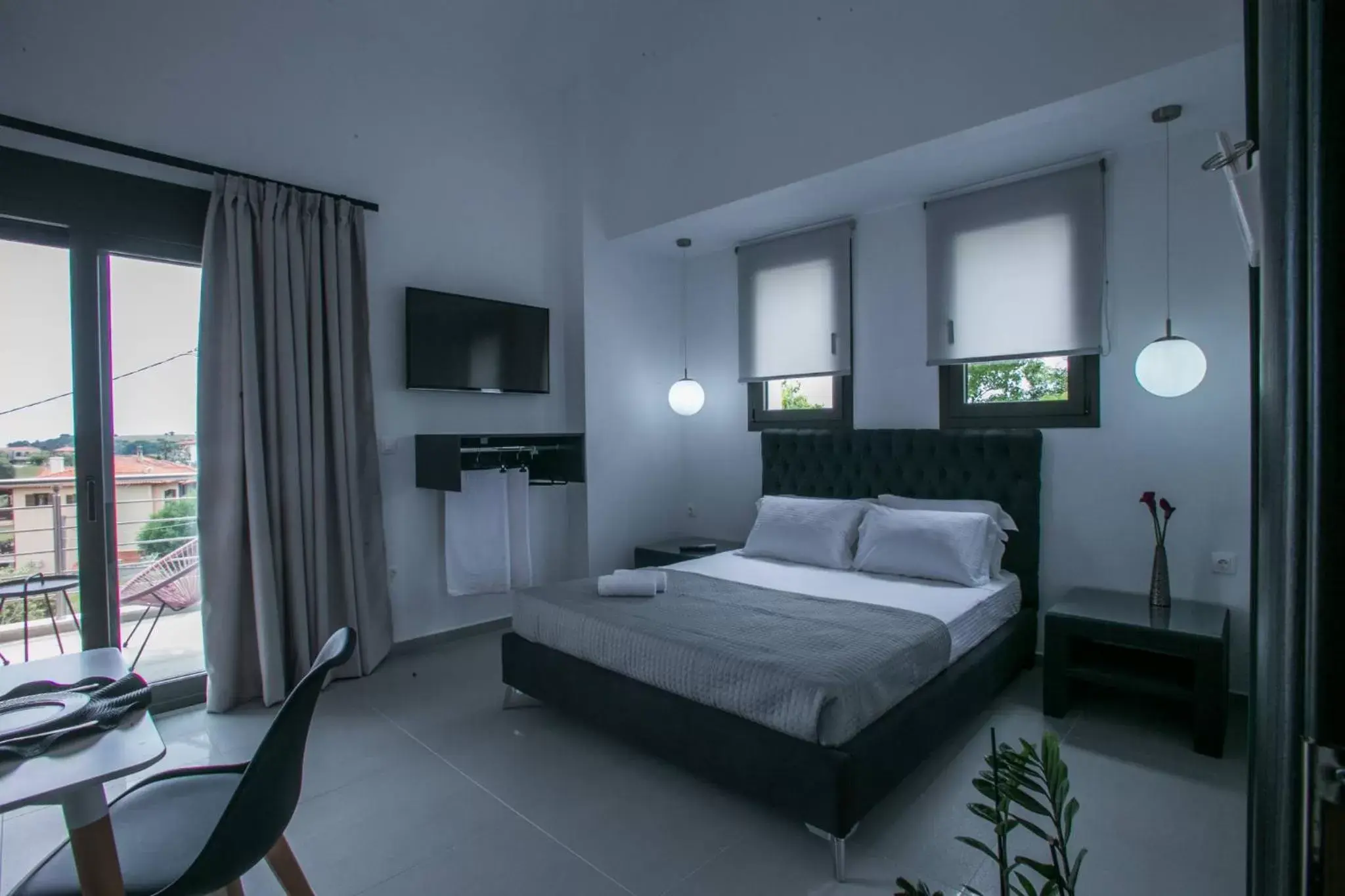 Bed in Anemos Luxury Apartments