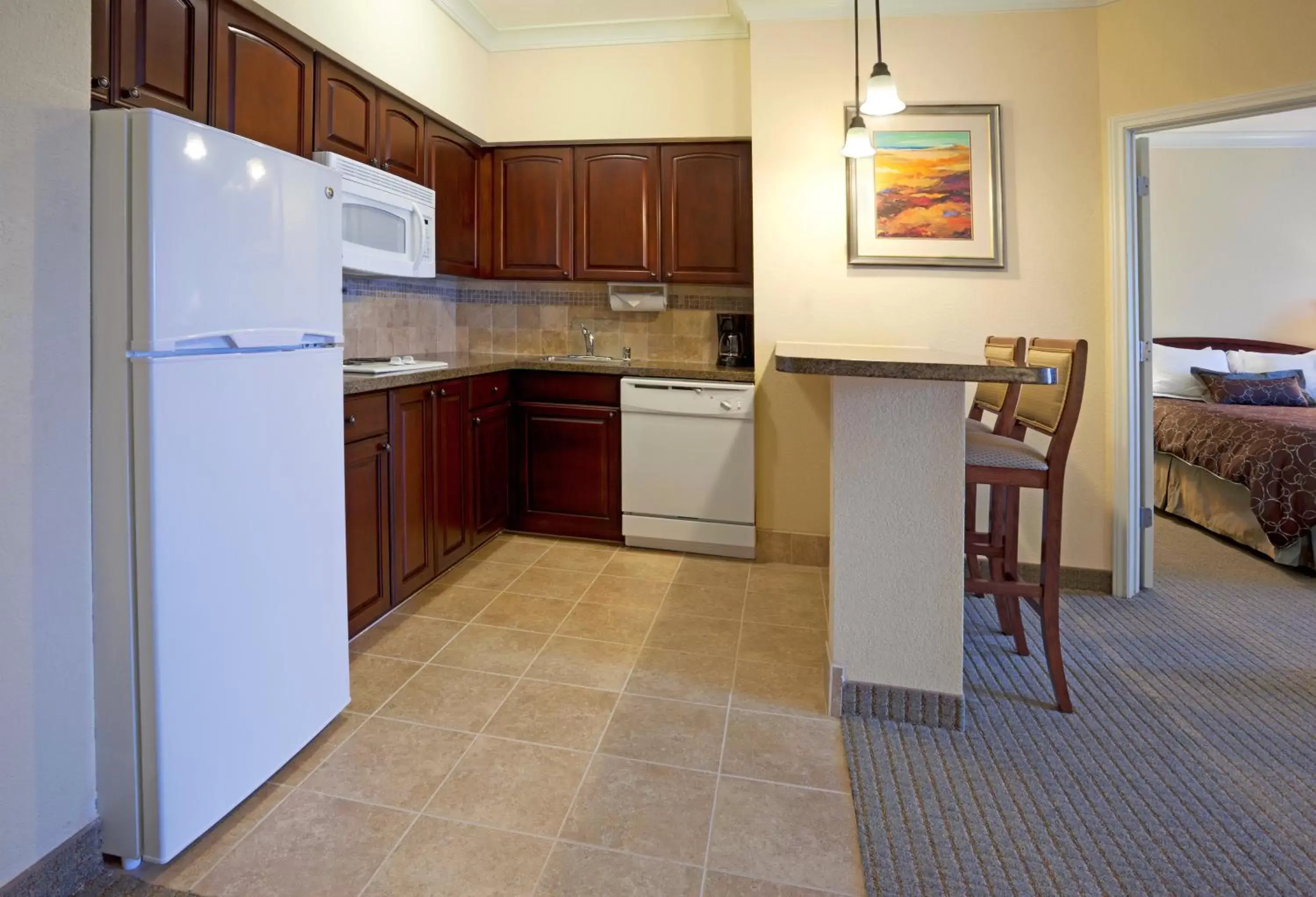 Photo of the whole room, Kitchen/Kitchenette in Staybridge Suites San Antonio Sea World, an IHG Hotel