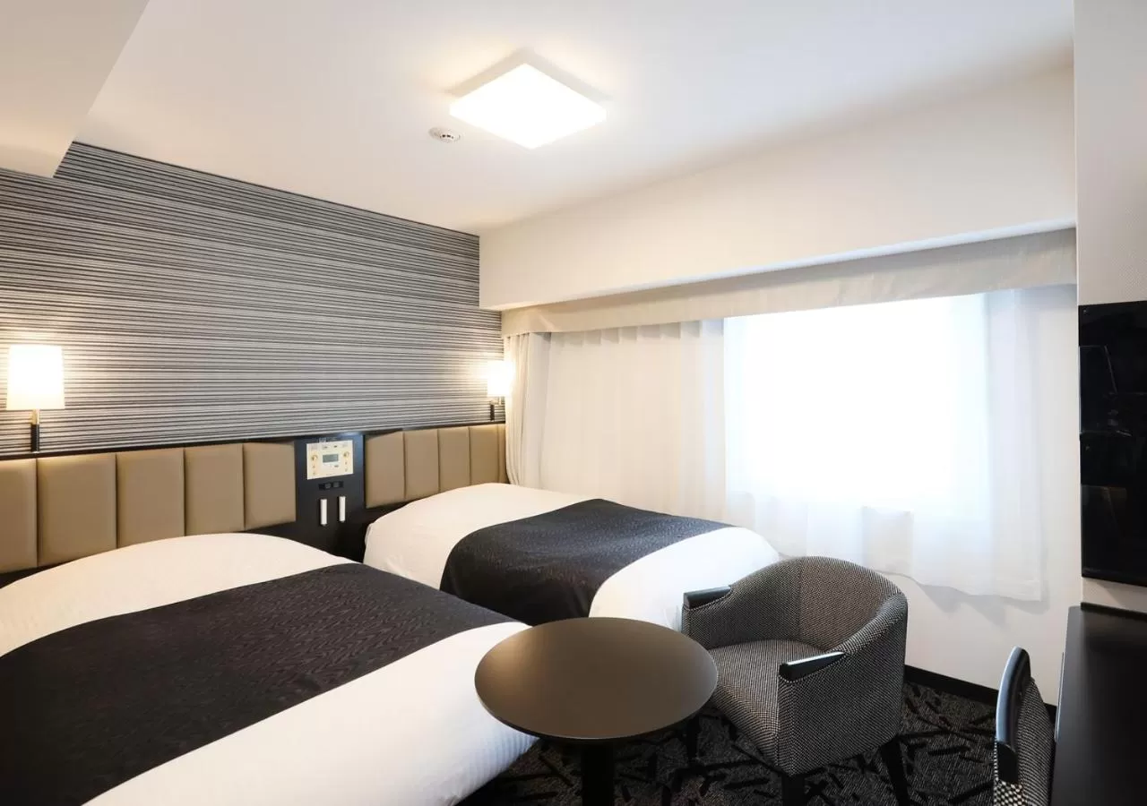 Photo of the whole room, Bed in APA Hotel & Resort Niigata Ekimae Odori